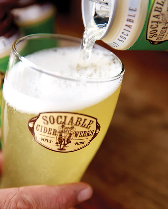 sociable-cider-werks-cider-pour-vertical-crdt-tate-carlson.jpg