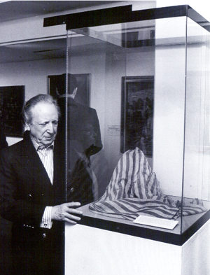 Peering at the pants he wore 55 years ago at the showing of his art at The Yeshiva University Museum in 1998.