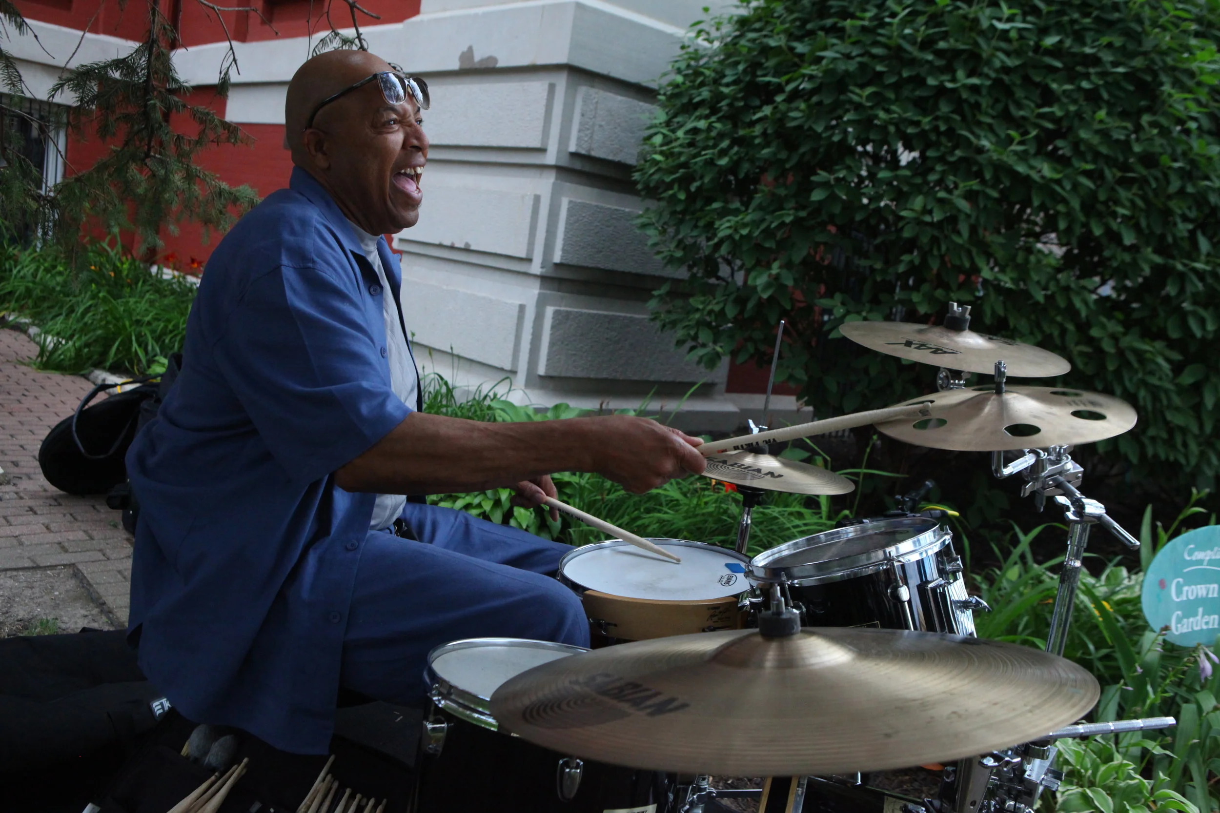 Thomas Sanders, of Griffith, accompanies the Voices of Love in their performance at the Crown Point Courthouse Lawn as a part of Gospel Fest on June 25, 2017.