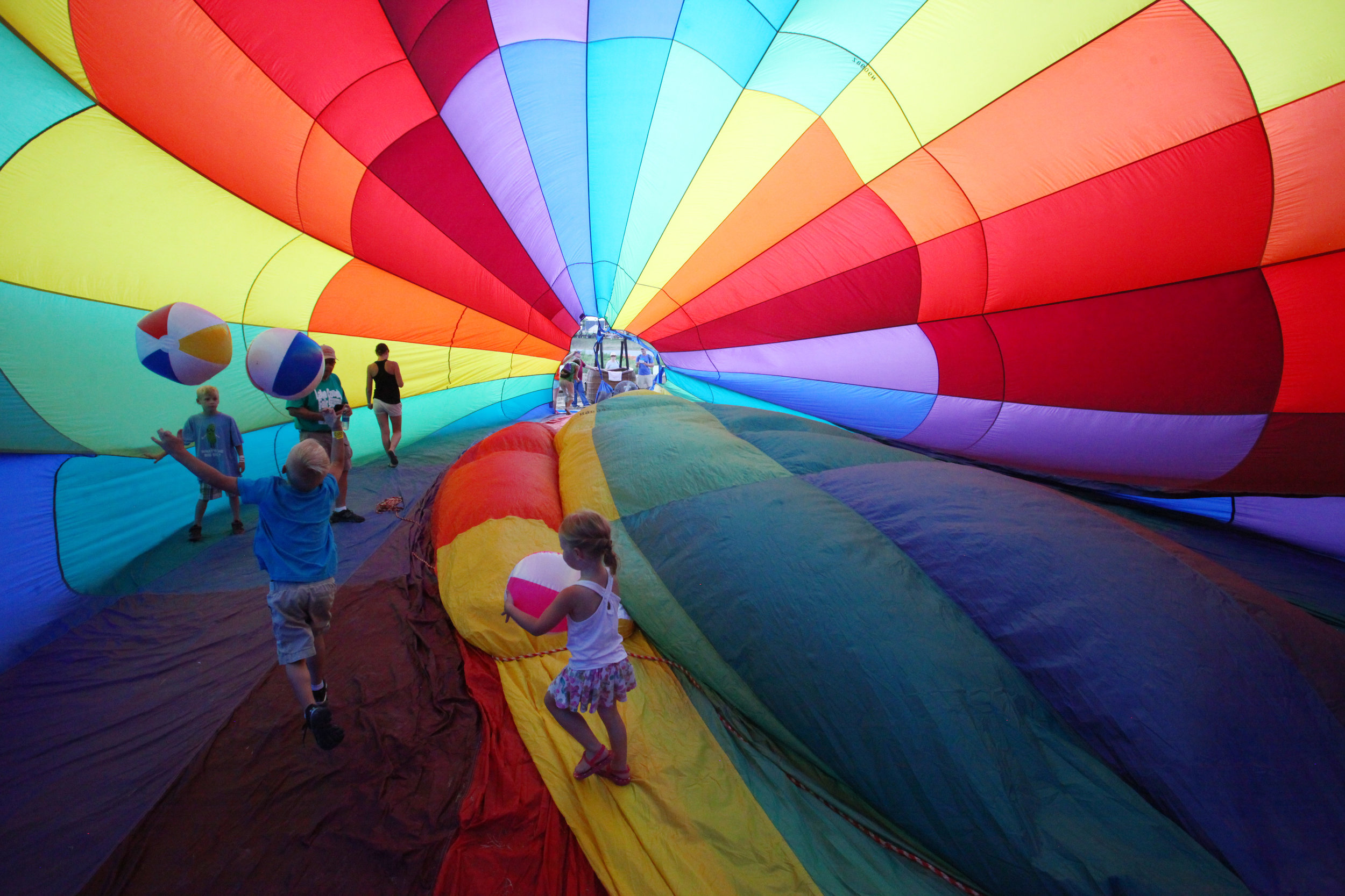 The Germeraad family, of St. John, checks out the interior of a hot air balloon on Aug. 7, 2018 at the Lake County Fair in Crown Point.