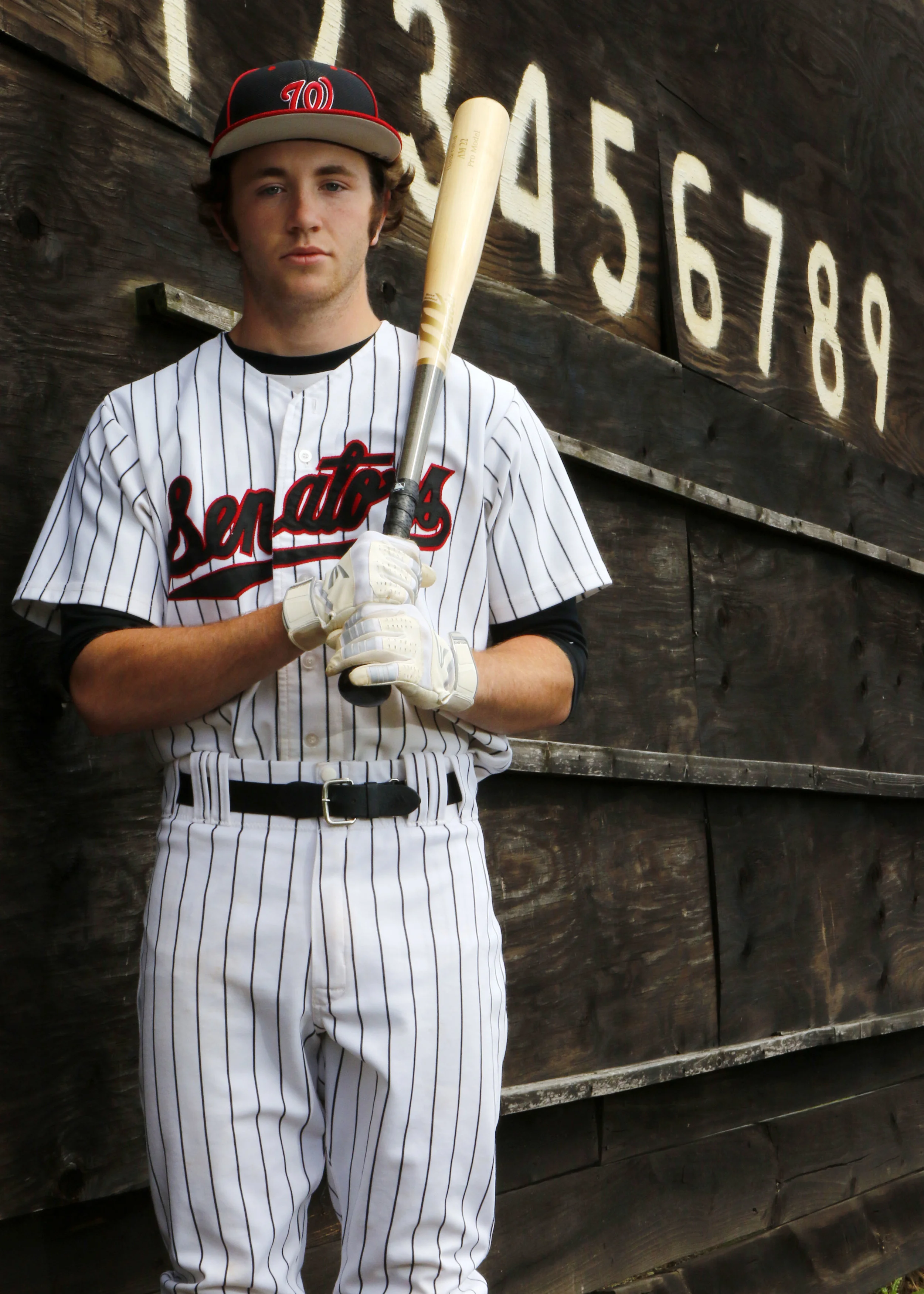 Washington Township baseball player James Churchill poses for a portrait near the scoreboard on the outfield wall at Washington Township High School on June 13, 2019.