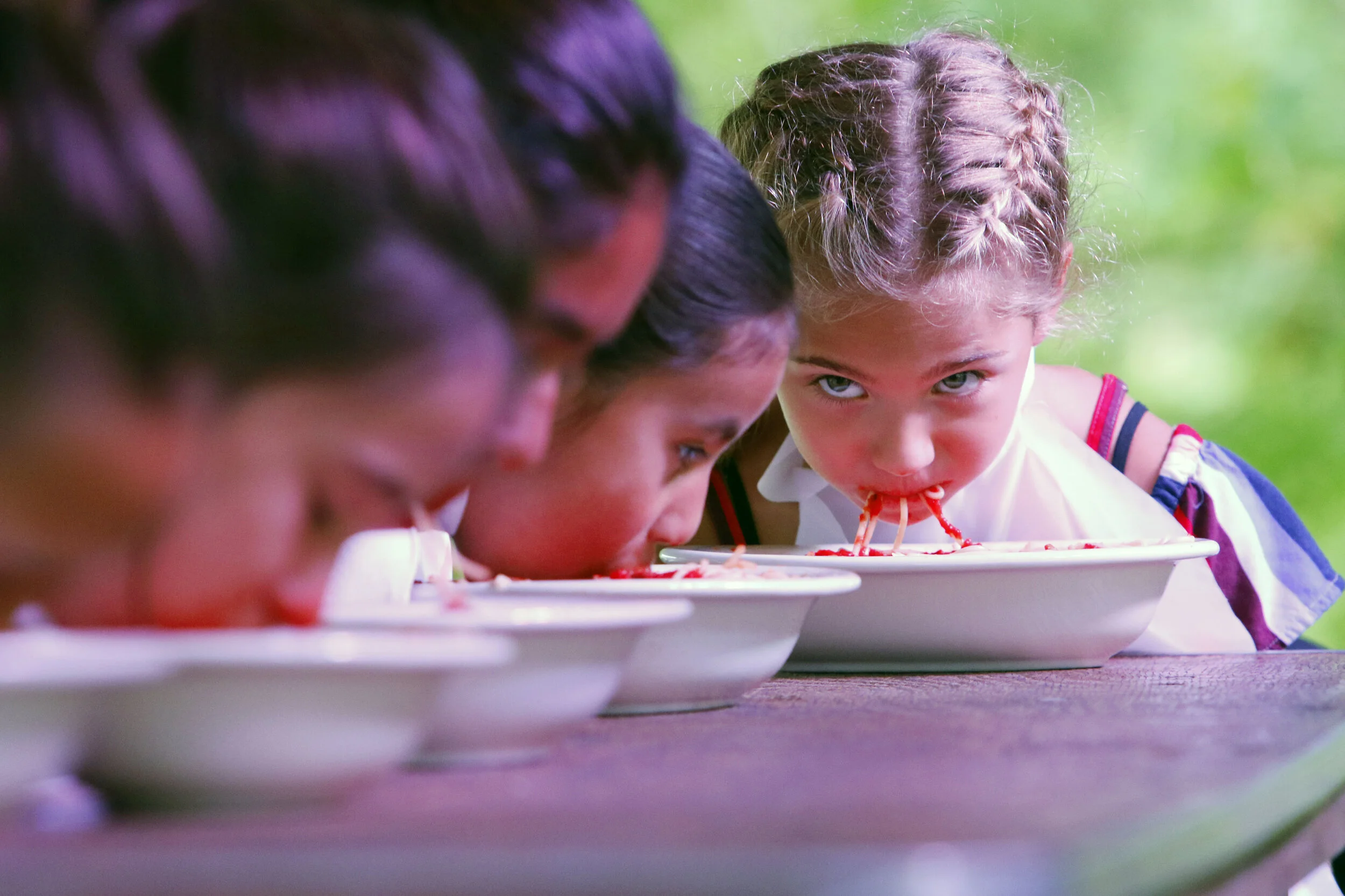 Laylah Maugeri, of Orland Park, Illinois, keeps an eye on her competition Aug. 17, 2019 during the spaghetti eating contest at Festa Italiana hosted at Villa Cesare in Schererville.
