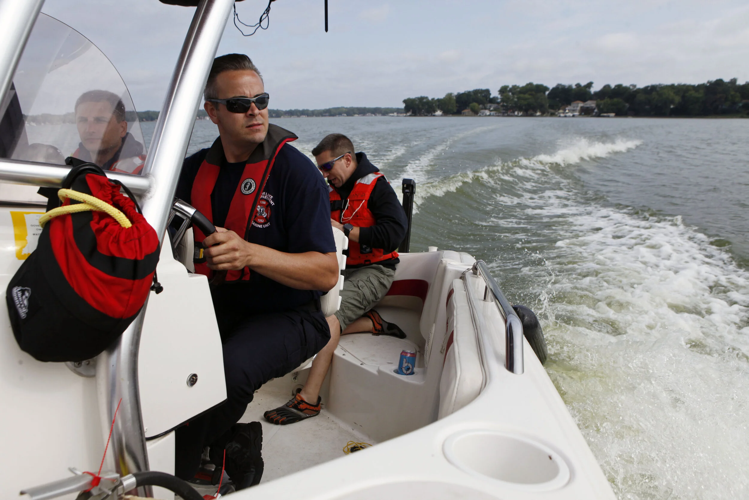 Cedar Lake firefighter and paramedic Tony DeAdam, center left, pilots a boat on Sept. 9. 2019 on Cedar Lake. MABAS teams spent the morning testing equipment and techniques.