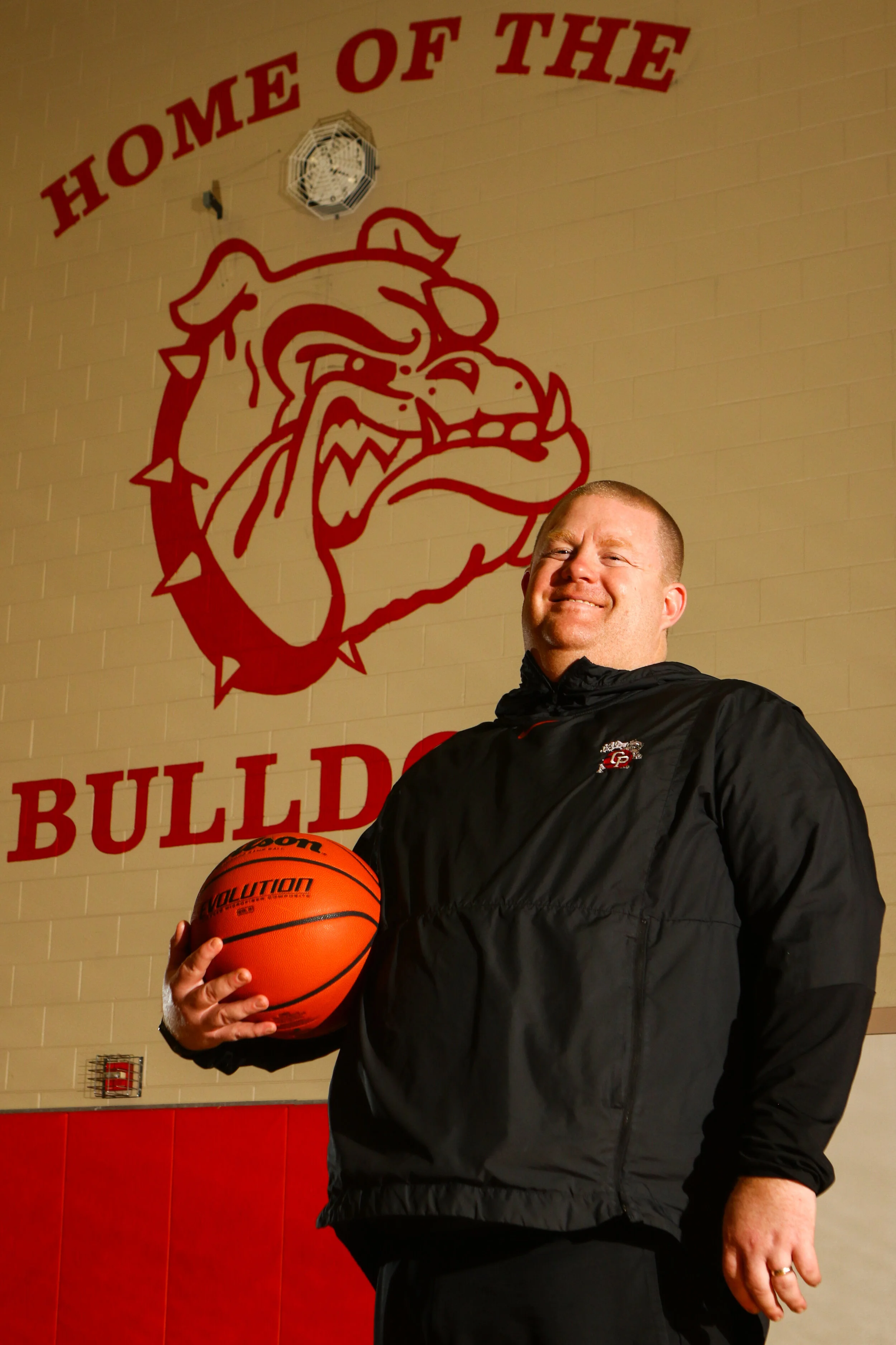 Crown Point girls basketball head coach Chris Seibert poses for a portrait in the school’s gymnasium on Feb. 23, 2021.