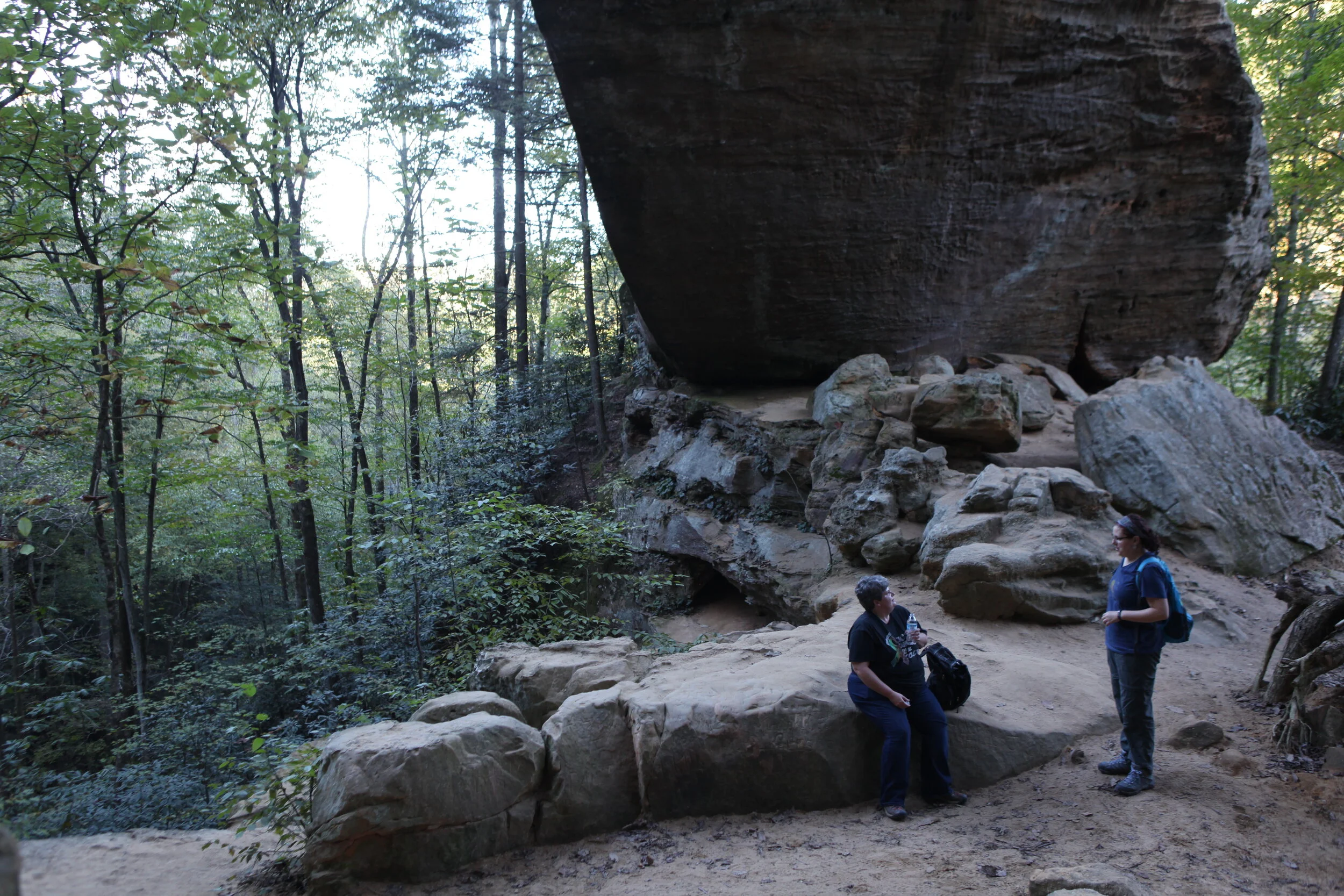  Wendy and Melanie Everman, a music teacher at the elementary school, pause for a drink and snack break under Gray’s Arch in the Daniel Boone National Forest in Powell County. Wendy and Melanie routinely drive out to hiking trails in the national for