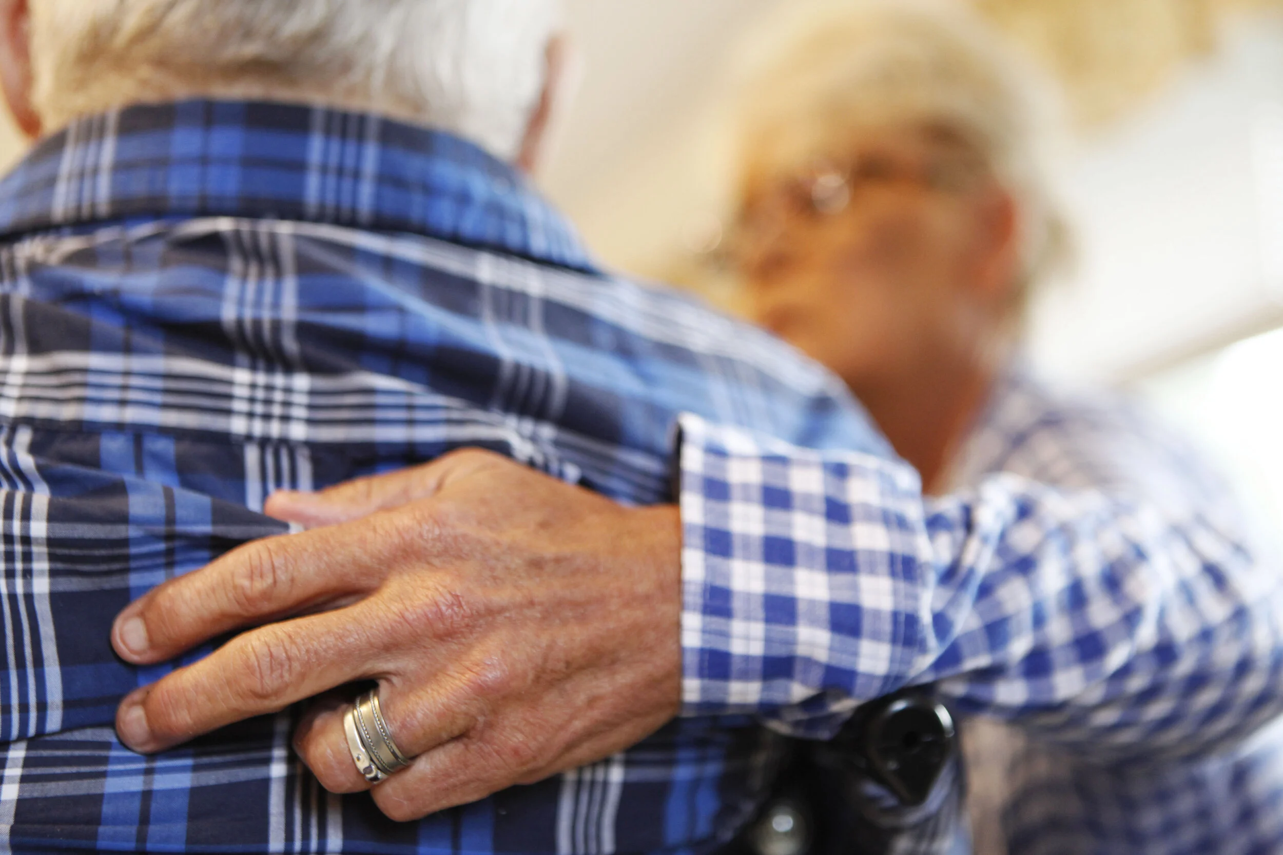  Velma Lang takes a moment to comfort one of Riverdell Care Center’s residents during breakfast. 