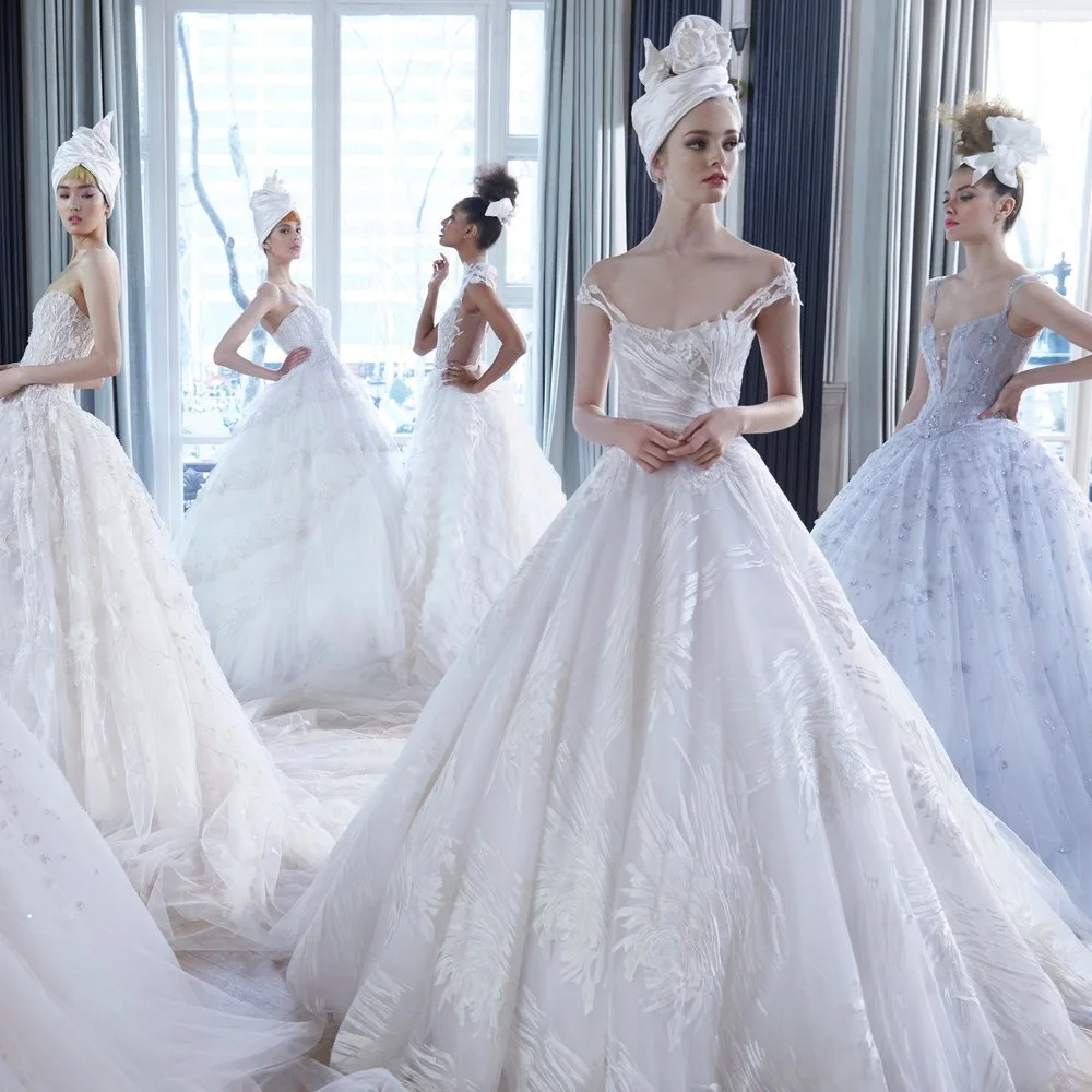 “Ines Di Santo is recognized as a leading designer of bridal and evening couture with designs that capture the essence of sophisticated glamour. Using techniques that are often found only in couture design, Ines plays to the feminine side of a woman’s beauty in both her bridal and evening collections. Raised in Buenos Aires with parents that inspired and supported her interest in the arts, Ines studied both fine art and design in Argentina and Milan. The signature, rich touch of sophistication and femininity seen within her designs reflect the designer’s Italian and Spanish heritage. Ines Di Santo designs are favored by discerning retailers, brides and celebrity red carpet events around the world. Leading an ever-expanding, international business, Ines and her family reside in Canada. While maintaining an office in United States, the company’s headquarters, atelier and flagship salon are located in Toronto. “