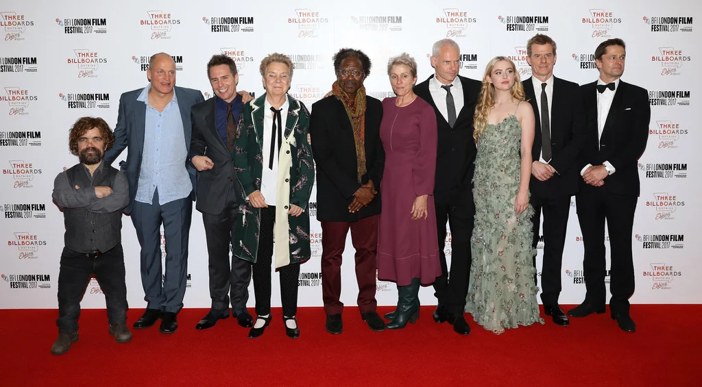 2. THE CAST OF "THREE BILLBOARDS OUTSIDE EBBING, MISSOURI" - Abbie Cornish, Peter Dinklage, Woody Harrelson, Zeljko Ivanek, Frances McDormand, Sandy Martin, Clarke Peters, Sam Rockwell. Lucas Hedges, Caleb Landry Jones (not pictured). " I’ve got American voices in my head. I couldn’t say that they’re specifically Missouri voices in my head. I know Sam went down and spoke to cops in the state and kind of recorded how they said a lot of the lines in the film. So he kind of tapped into some kind of accuracy about the dialect. But Fran isn’t from there, but she’s Ohio. And Woody’s Texas. So they’re all sort of the region, to a degree, or they understand the sensibility. And they’re all good actors, too. I mean I traveled around America; I have traveled around America a lot and listened to how people speak generally, or how I think they speak. (Regarding Sam Rockwell's racist police officer character): None of these characters are simple heroes and villains, so there’s never a point where you’re saying he’s the hero or he’s even decent at the end. But you can say that he is trying to change and where does that leave us? And that’s all that the film is kind of doing. It’s not saying that he’s a good guy now or that this erases all the violence or any of that stuff. And I guess you also kind of question how many people who are racist wouldn’t ever call themselves racist, too." - director Martin McDonagh, Uproxx, November 7, 2017