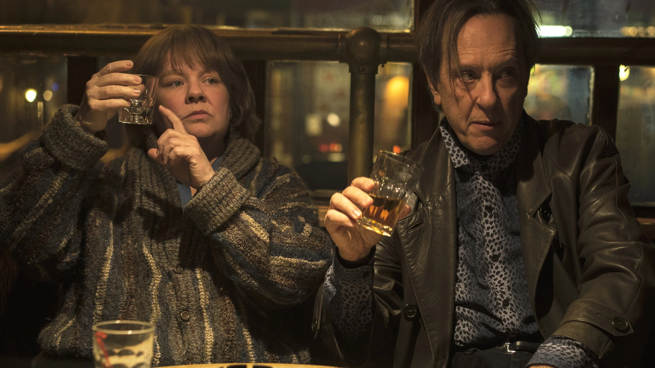 16. MELISSA MCCARTHY, RICHARD E. GRANT | Lee Israel (McCarthy), Jack Hock (Grant) | CAN YOU EVER FORGIVE ME? A biographer, reaching rock bottom in her career and personal life, turns to creating celebrity forgeries, with her best friend as accomplice, in Marielle Heller’s adaptation of novelist Lee Israel’s true story. (McCarthy on playing Lee Israel): “What would any of us do? I mean, this was her survival. This wasn't like, she saw a great grift and like wanted a new car. It was like, what would any of us do? I thought about if I couldn't take care of my children, what would any of us do? And it's not that unreasonable to think you are pushed into circumstances that you, you know, you would think you would never find yourself. And that would be the great human equalizer, it's like no one can look at her story and say, well I would never do that. Because she was on welfare, it's like, what else would you do?” - Forbes, October 26, 2018 (Grant): “I didn’t know her story, but I had her biography of Tallulah Bankhead, which I’d read, and which is really good. I had her name on my bookshelf but this story, I didn’t know. I thought, ‘How is it possible that I didn’t know about this story?’ It’s such an extraordinary, grand feat of literary ventriloquism that she pulled off, passing off these letters of really great writers of such disparate talents and styles in the 20th century. I thought that was an amazing thing. Now her story’s out there. I just wish that she was alive to see how celebrated it is for her crimes. Crimes of passion really. It’s a buddy heist. It’s like a buddy road movie to me, one that happens to go through the highways of Manhattan, from bar to bookshelf to bar to bookshelf to seedy apartment and then back again. Like Butch Cassidy and the Sundance Kid in the Wild West of Manhattan and downtown in the 1990s, without the guns and the pistols. There’s no dead bodies.” - Vox, October 18, 2018