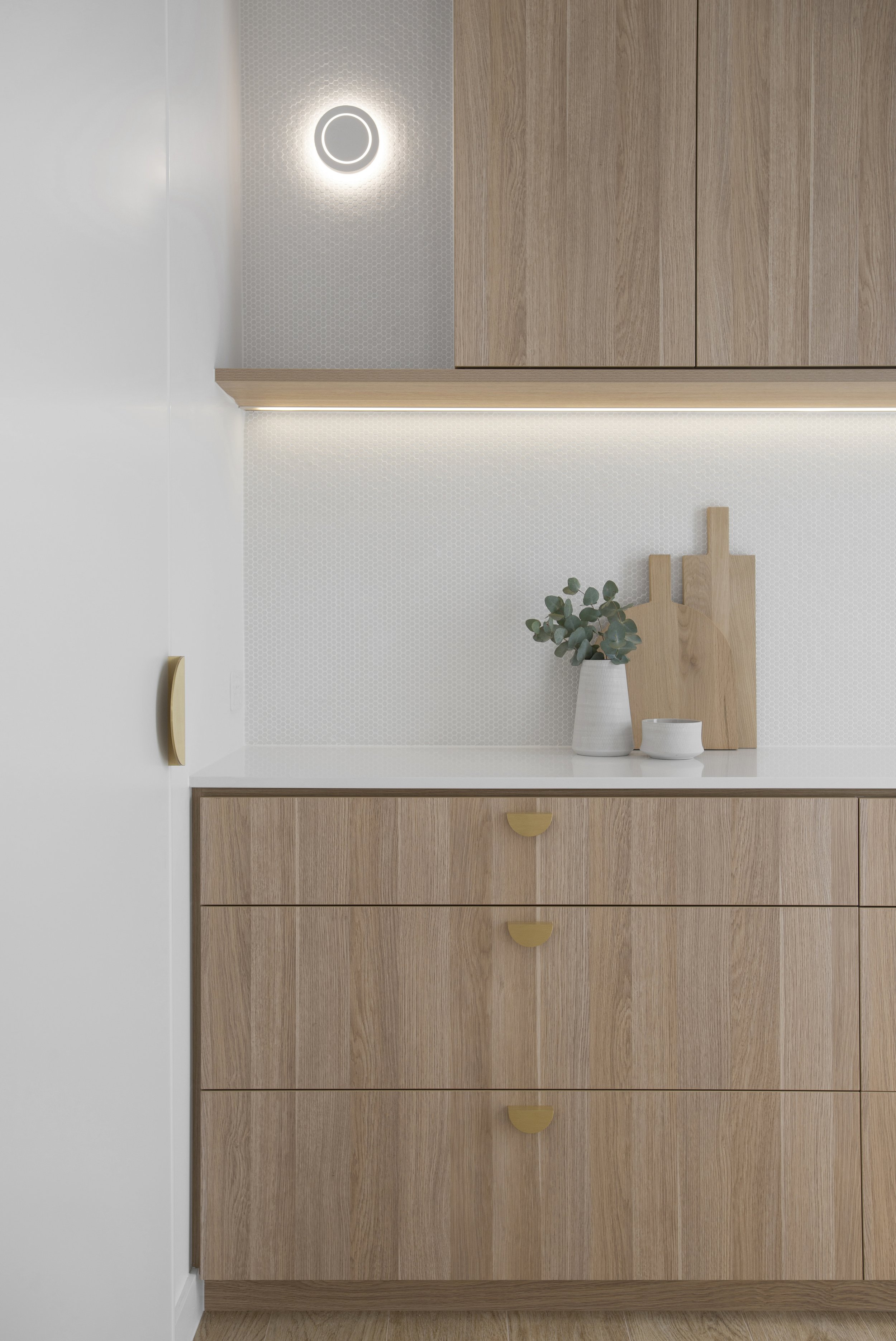 Wooden cabinets and white plant pot on the counter in classic coastal butler's pantry project included in classic coastal home design bundle for home remodel