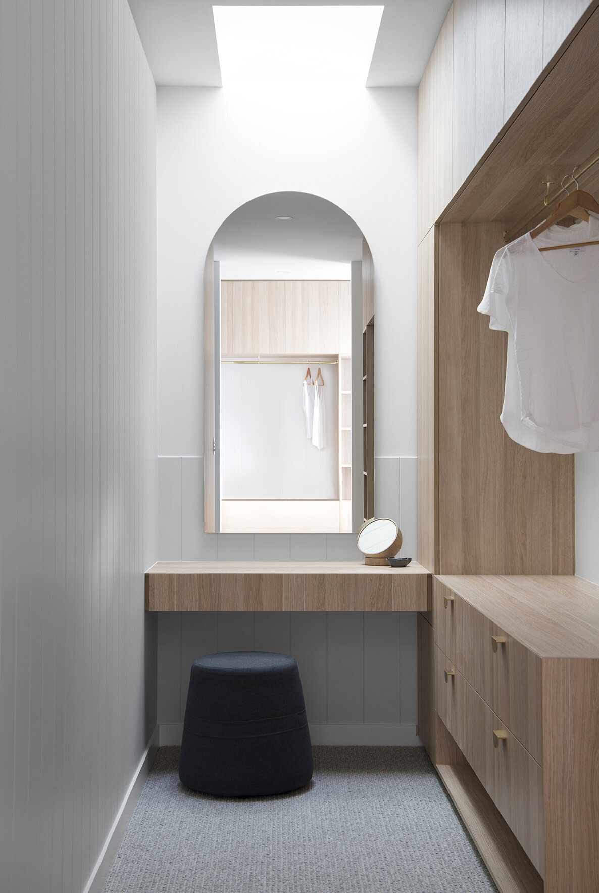 Wooden clsoets and blacklit makeup mirror in the classic coastal walk in wardrobe project included in classic coastal home design bundle home renovation ideas