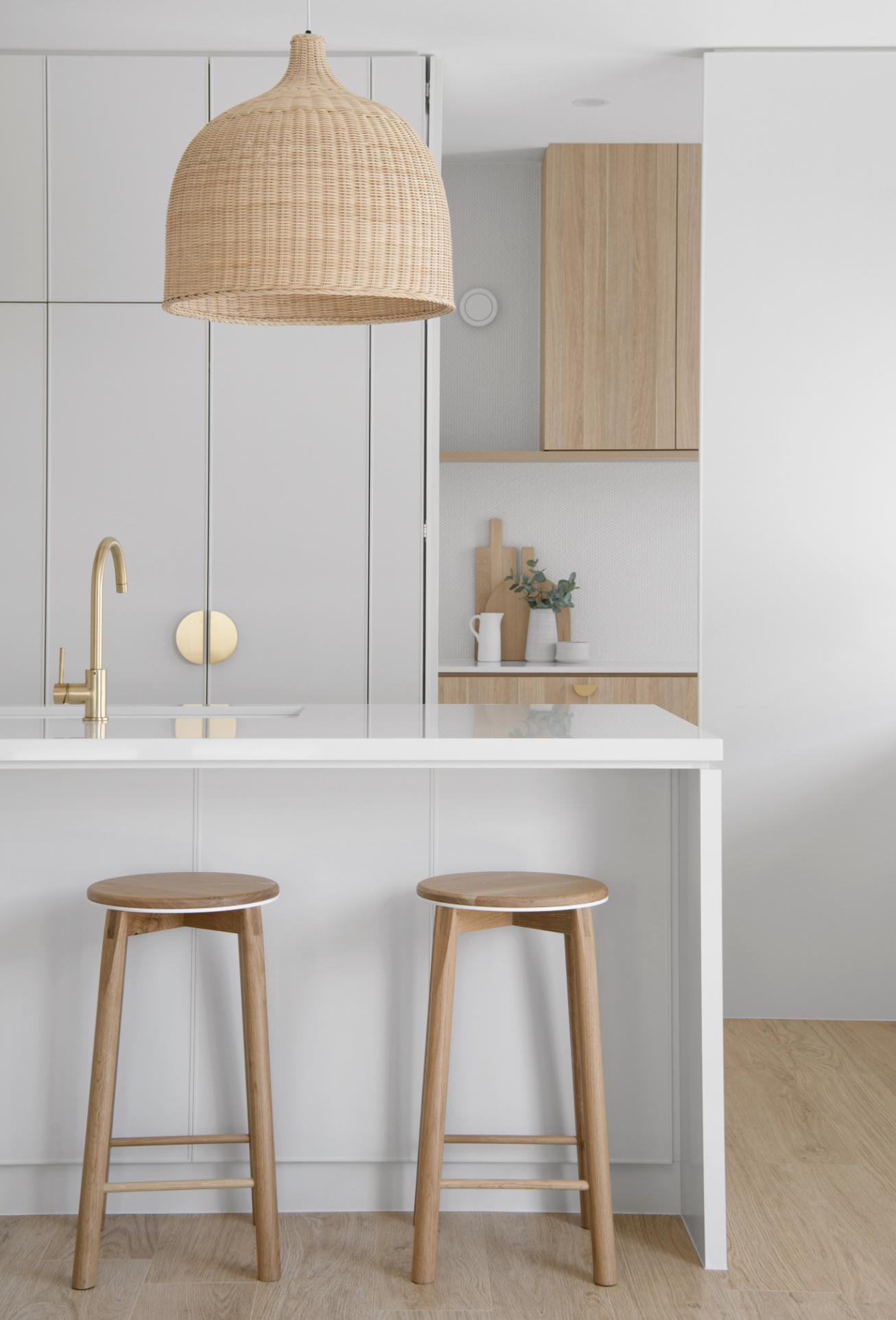 Wood stools and a white kitchen counter from contemporary coastal kitchen design project included in the kitchen design bundle. kitchen renovation melbourne