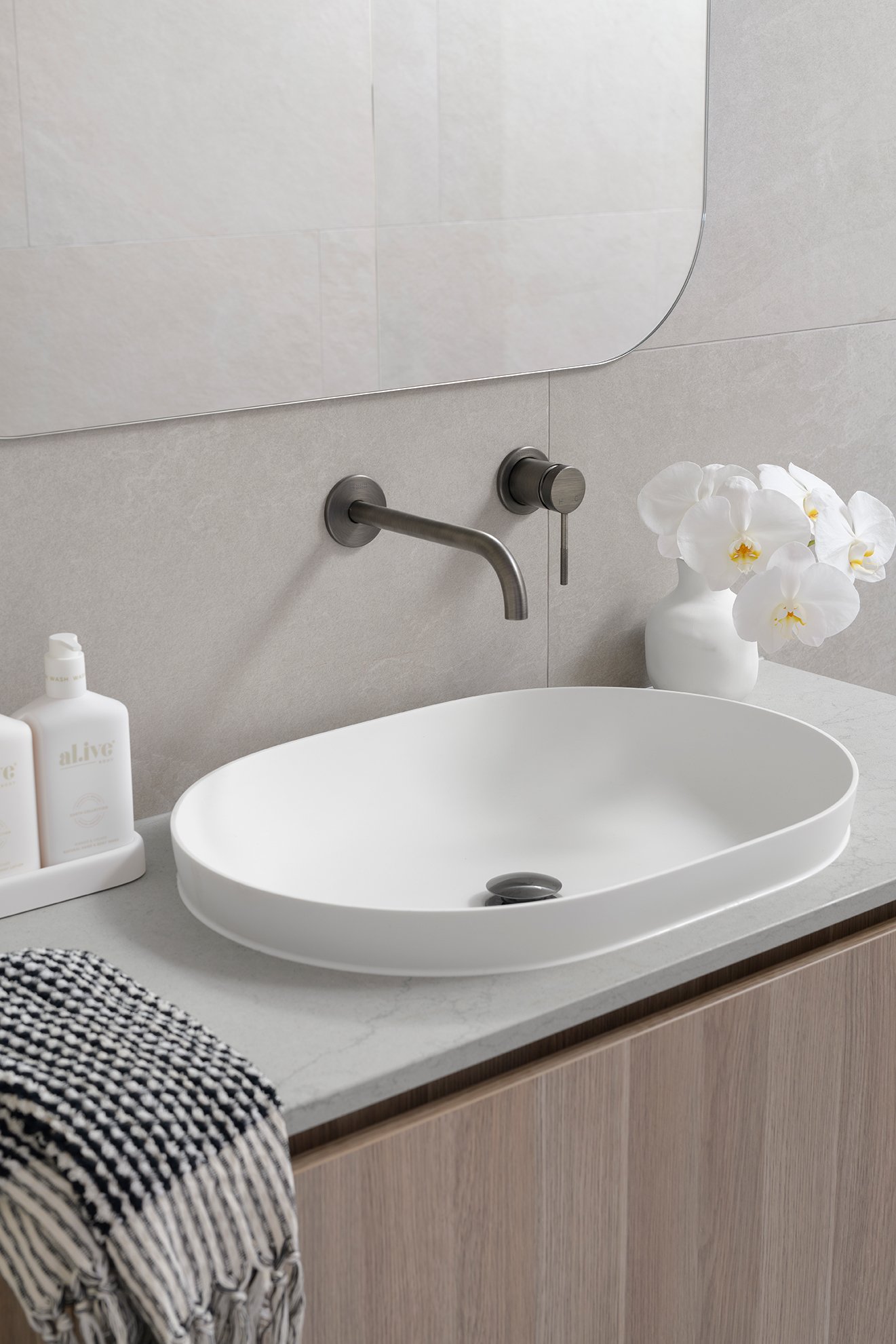 White small oval sink basin and silver faucet in fifty shades bathroom plans
