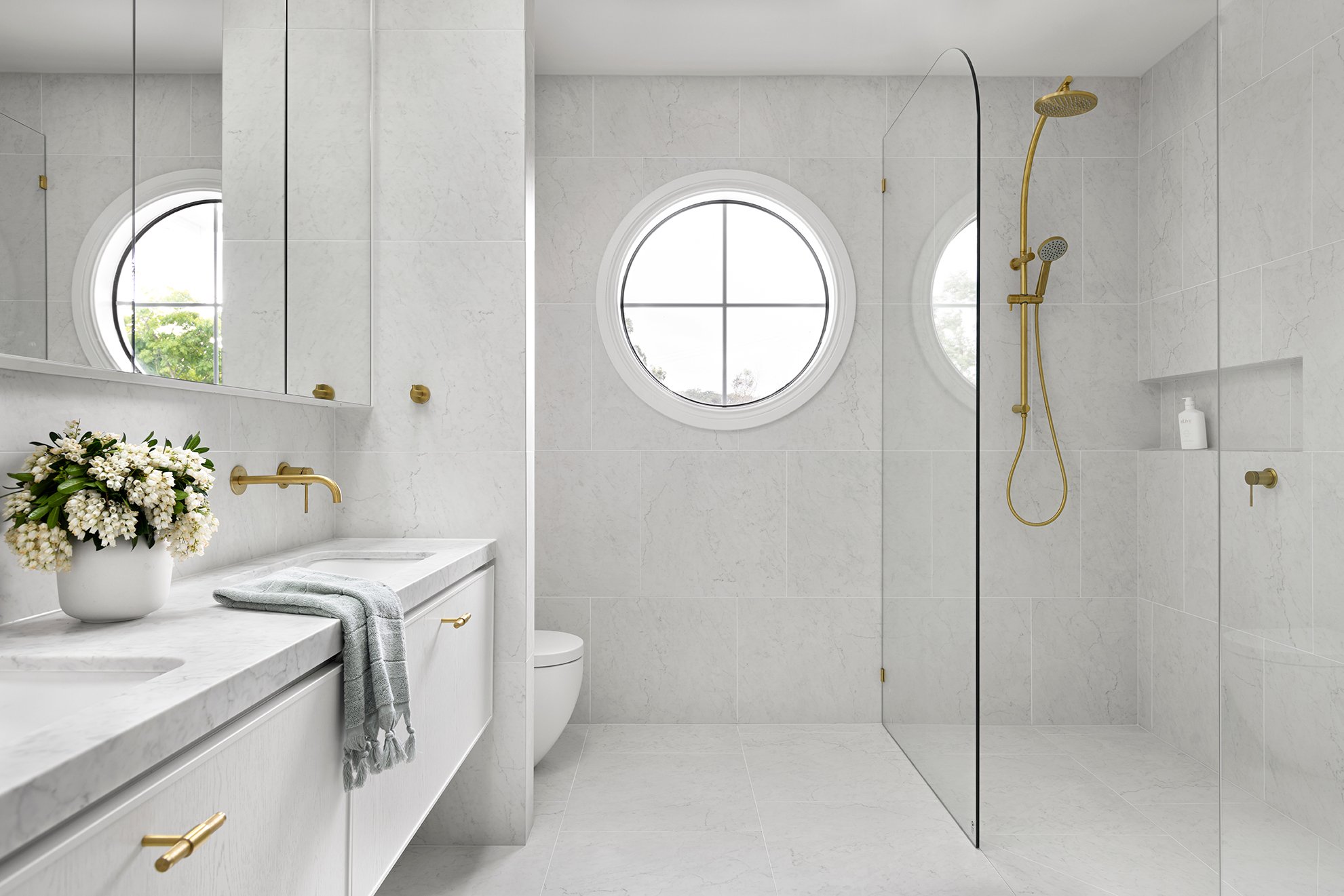 hamptons home design guide plans elevations ensuite bathroom brass tapware shower carrara tiles stone round window www.zephyrandstone.com.au