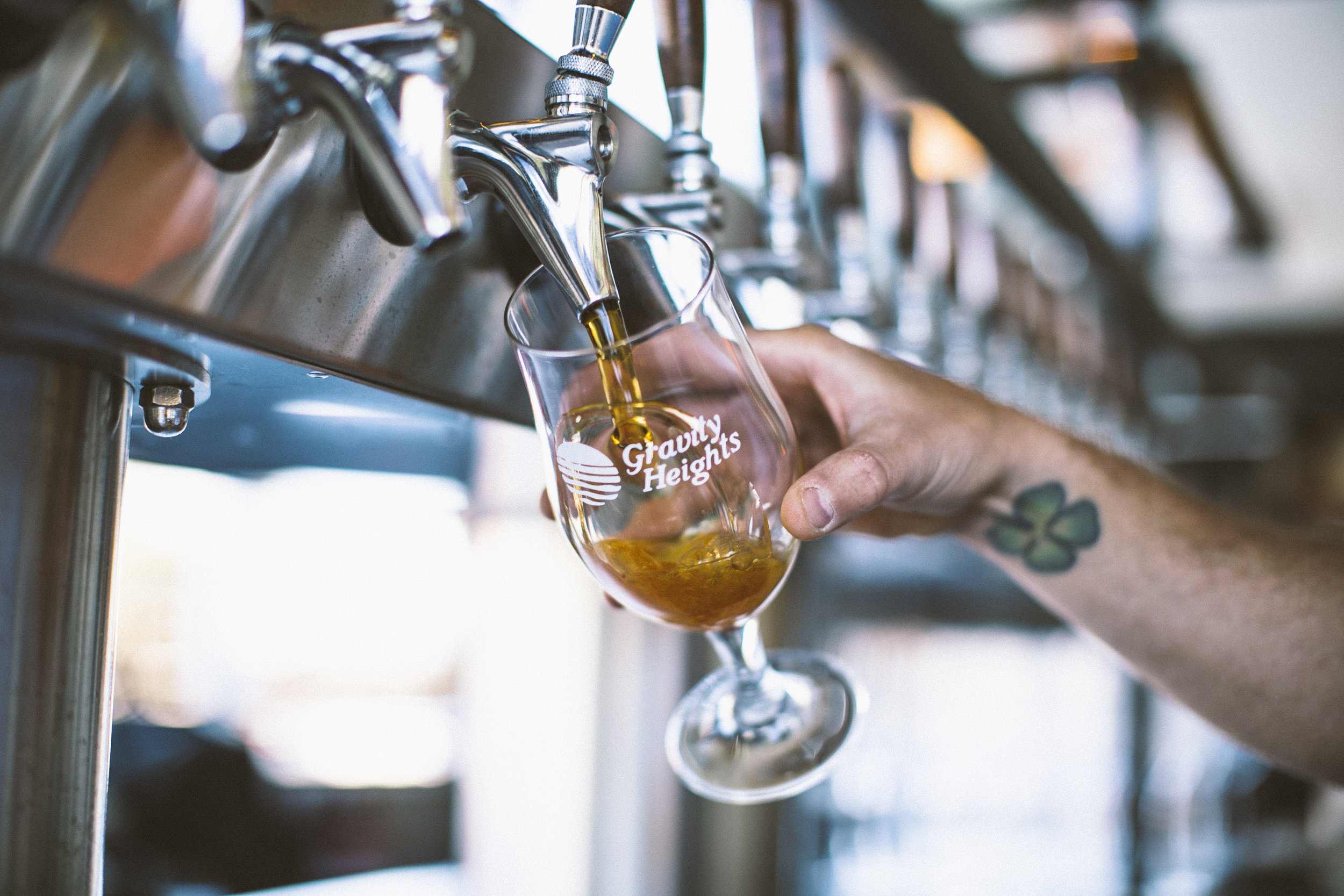 Beer pouring into glass from tap