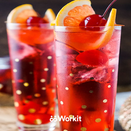 red sherry temple mocktail with orange and cherry garnish