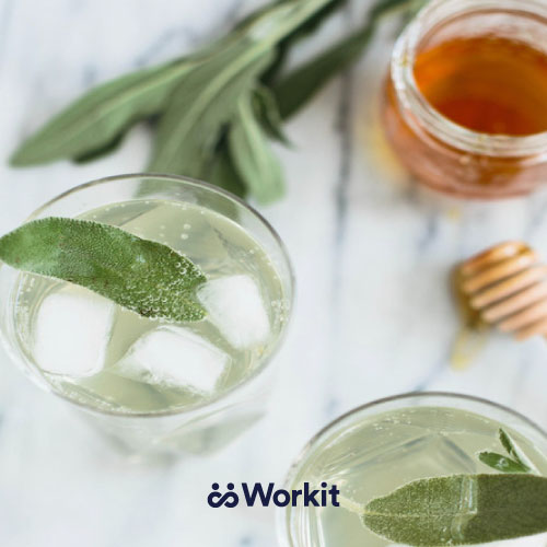 glasses of sage and honey mocktails with sage as garnish