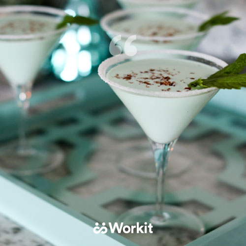 martini glasses with creamy liquid garnish with cocoa powder and mint leaf