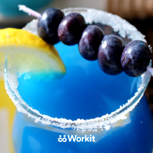 bright blue mocktail with blueberry and lemon garnish