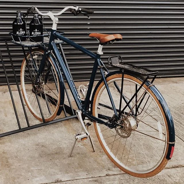 Dave is left heartbroken, as his beloved bike was stolen this morning from Kakaako.. It is a vintage, dark blue bicycle with a chainless belt drive, leather seat, and racks in both the front and back. Any information on its whereabouts or leads to its safe return will be rewarded with a keg of beer and the endless gratitude of a now bikeless brewmaster. #FINDDAVESBIKE