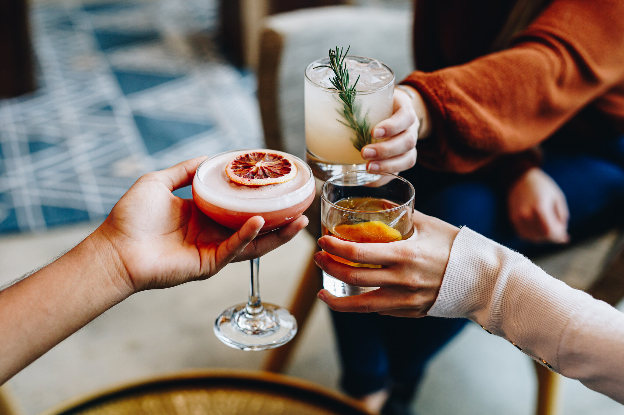 Three cocktails cheersing