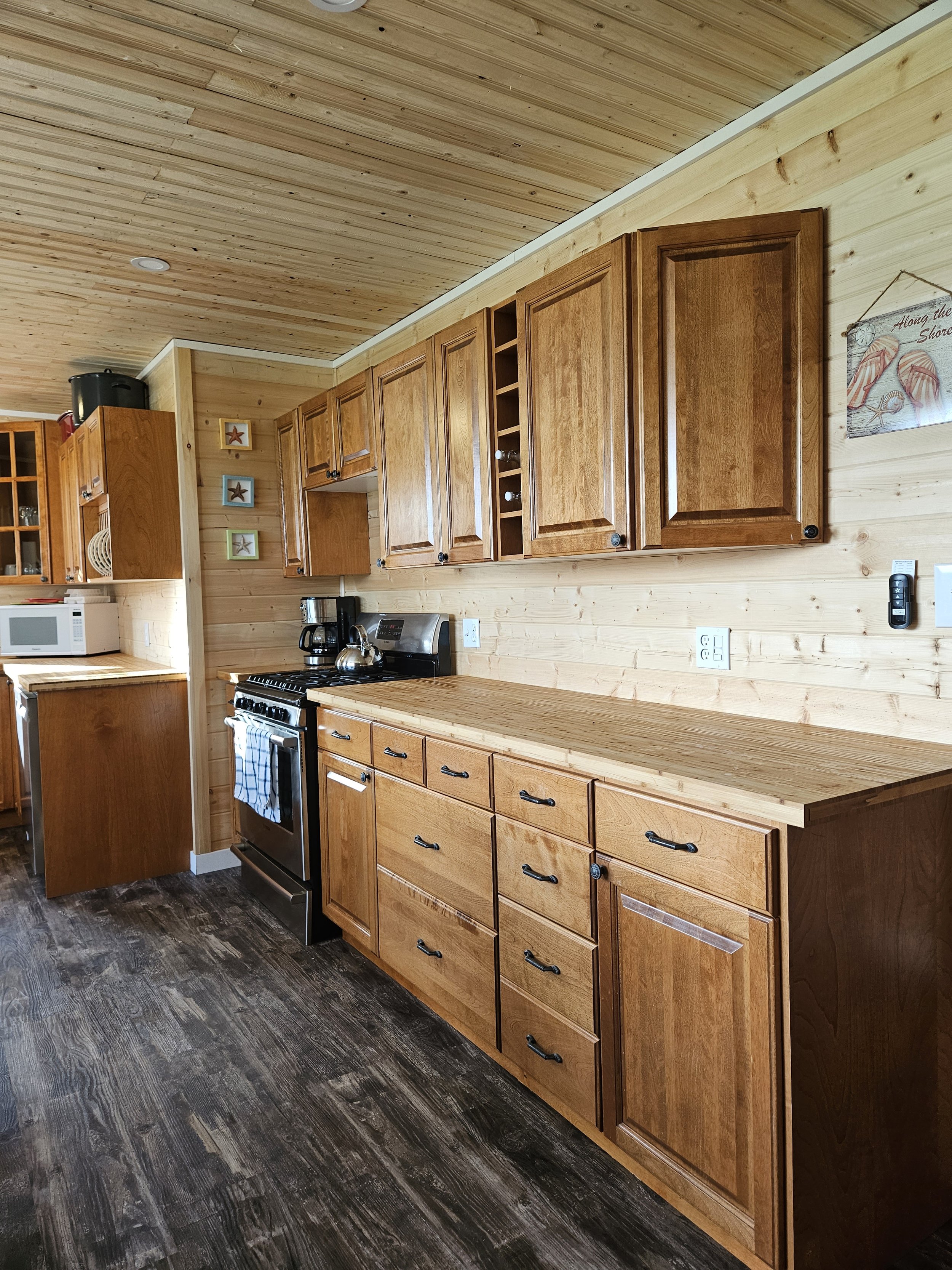 Kitchen- Beachhouse- new vinyl plank flooring, new cabinets, new pine walls and ceiling, new dishwasher.jpg