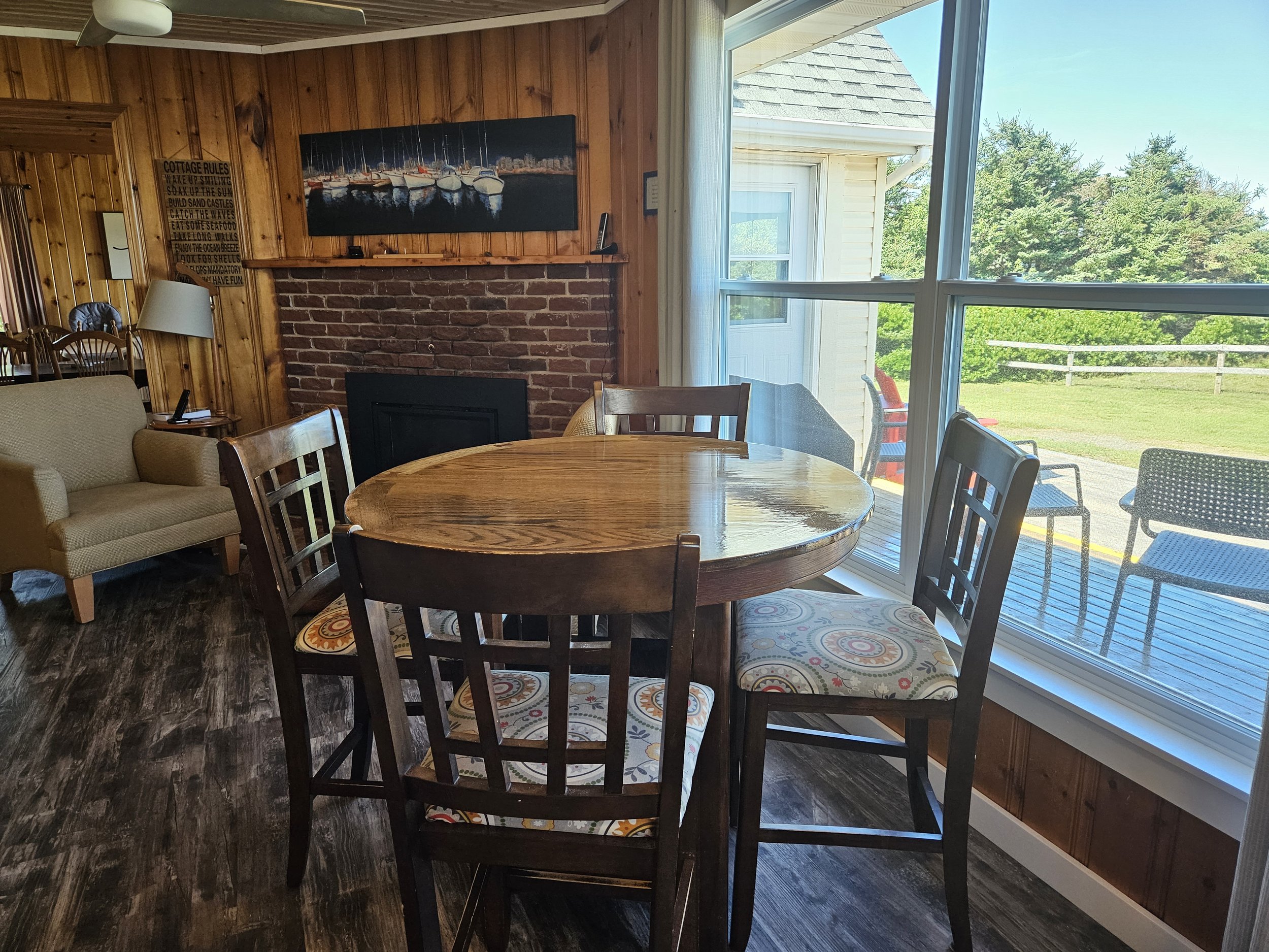 Kitchen Dining Area with view of deck and propane insert from 4 seat high top maple table.jpg