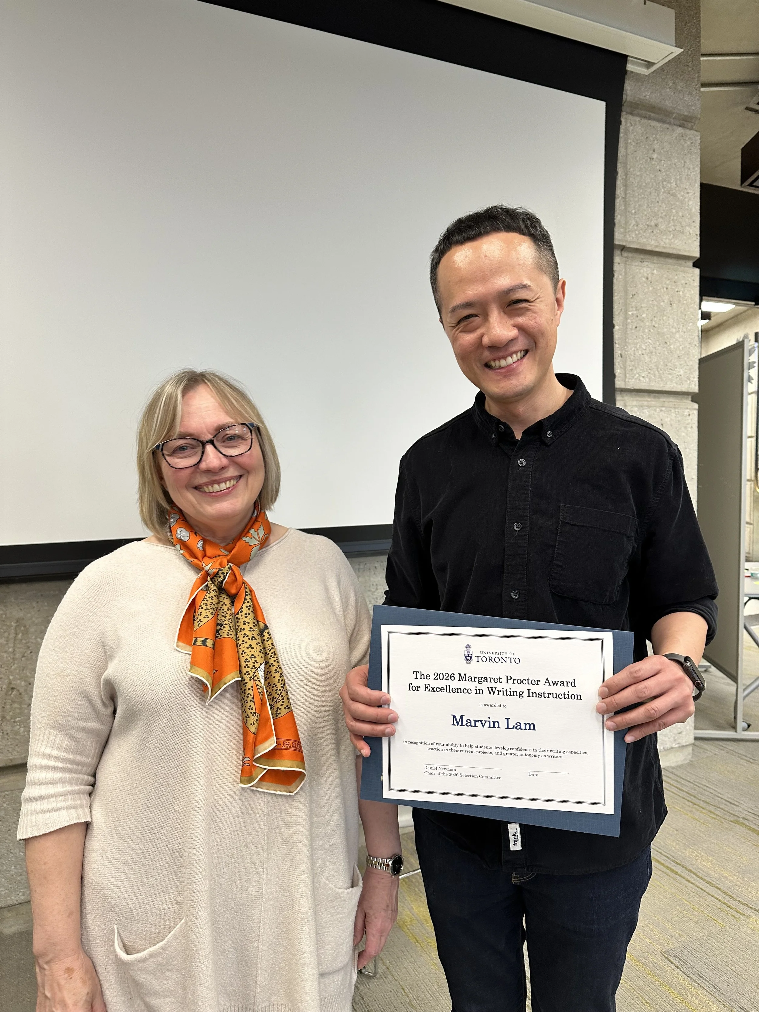 Marvin Lam holds his award certificate alongside Boba Samuels, HSWC's director.