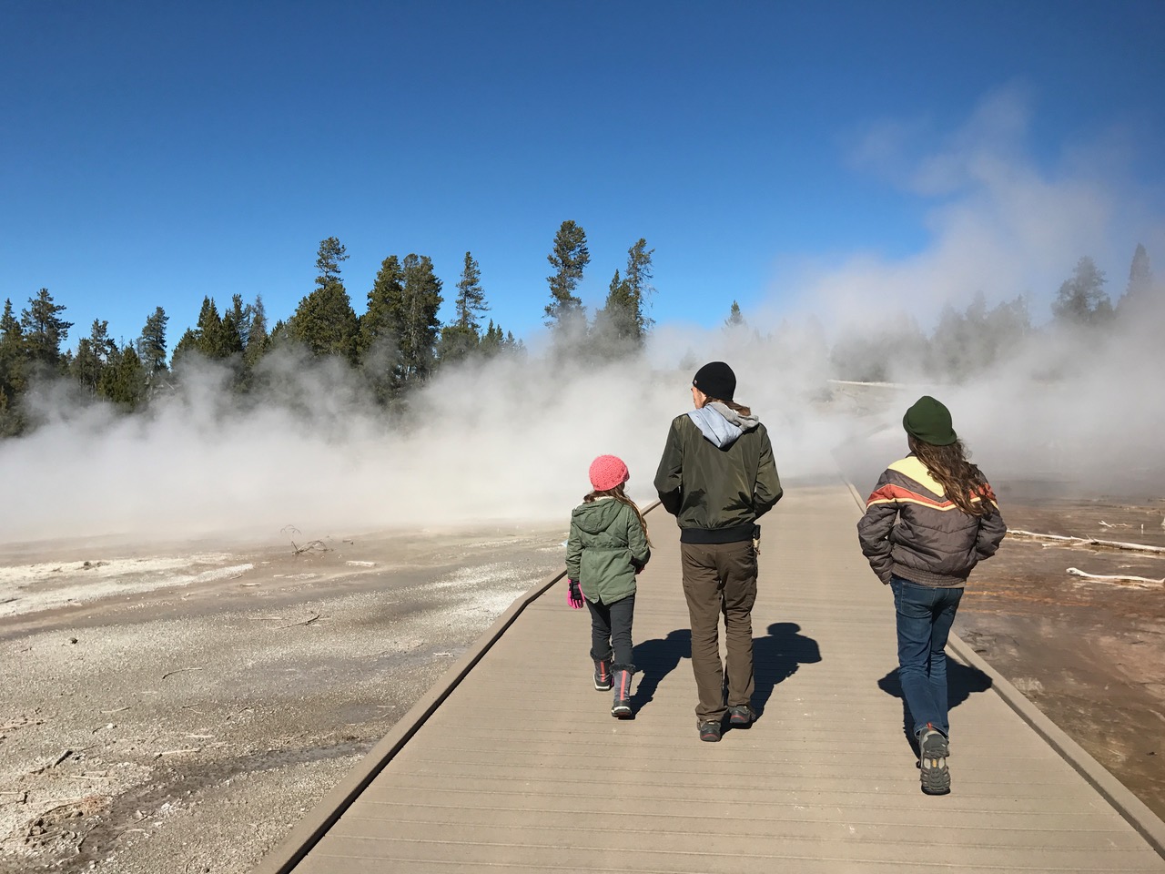 Walking along a boardwalk over the hot springs