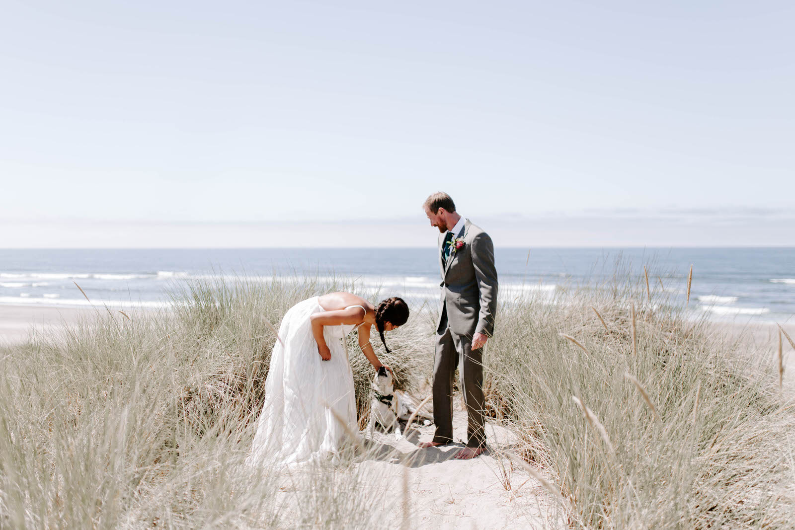 pacific city cape kiwanda community center oregon coast wedding beach feminist queer lgbtq photographer jamie carle lgbt overcast sunny harsh sun reception pink bridesmaids dresses