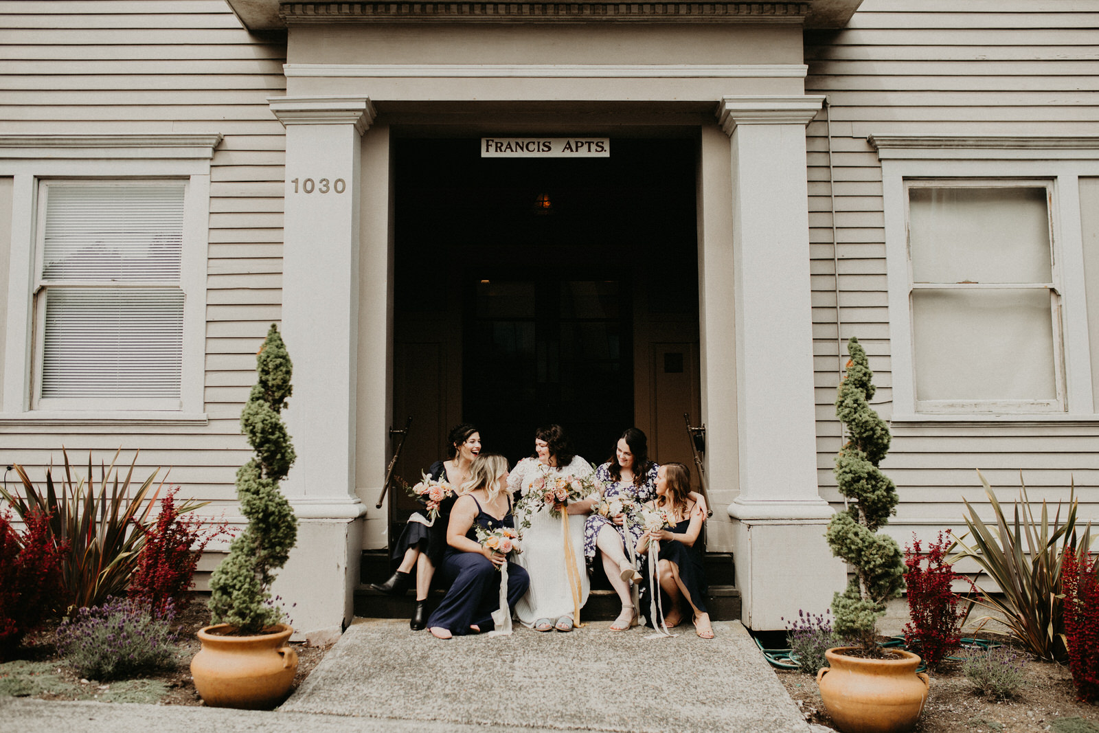 ashley joel astoria oregon the ruins wedding venue florals portland washington coast balloons vintage ceremony reception jamie carle feminist lgbtq lgbt couple photographer photography