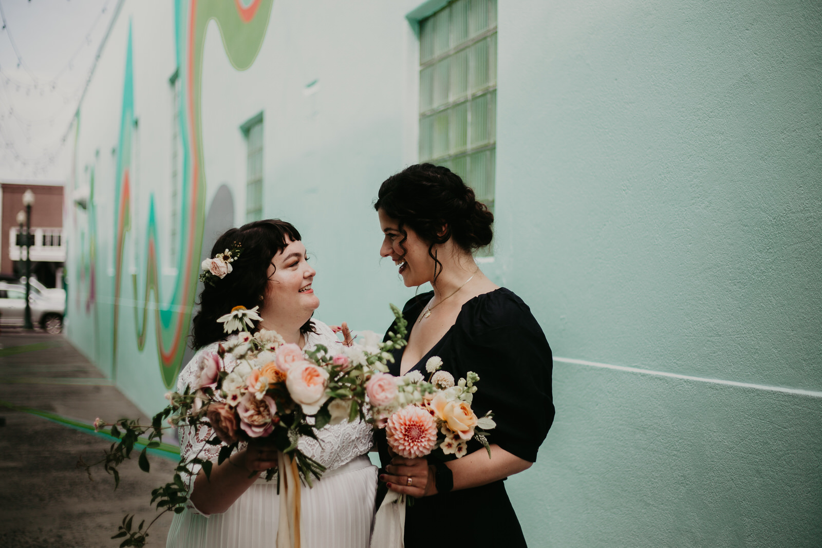 ashley joel astoria oregon the ruins wedding venue florals portland washington coast balloons vintage ceremony reception jamie carle feminist lgbtq lgbt couple photographer photography