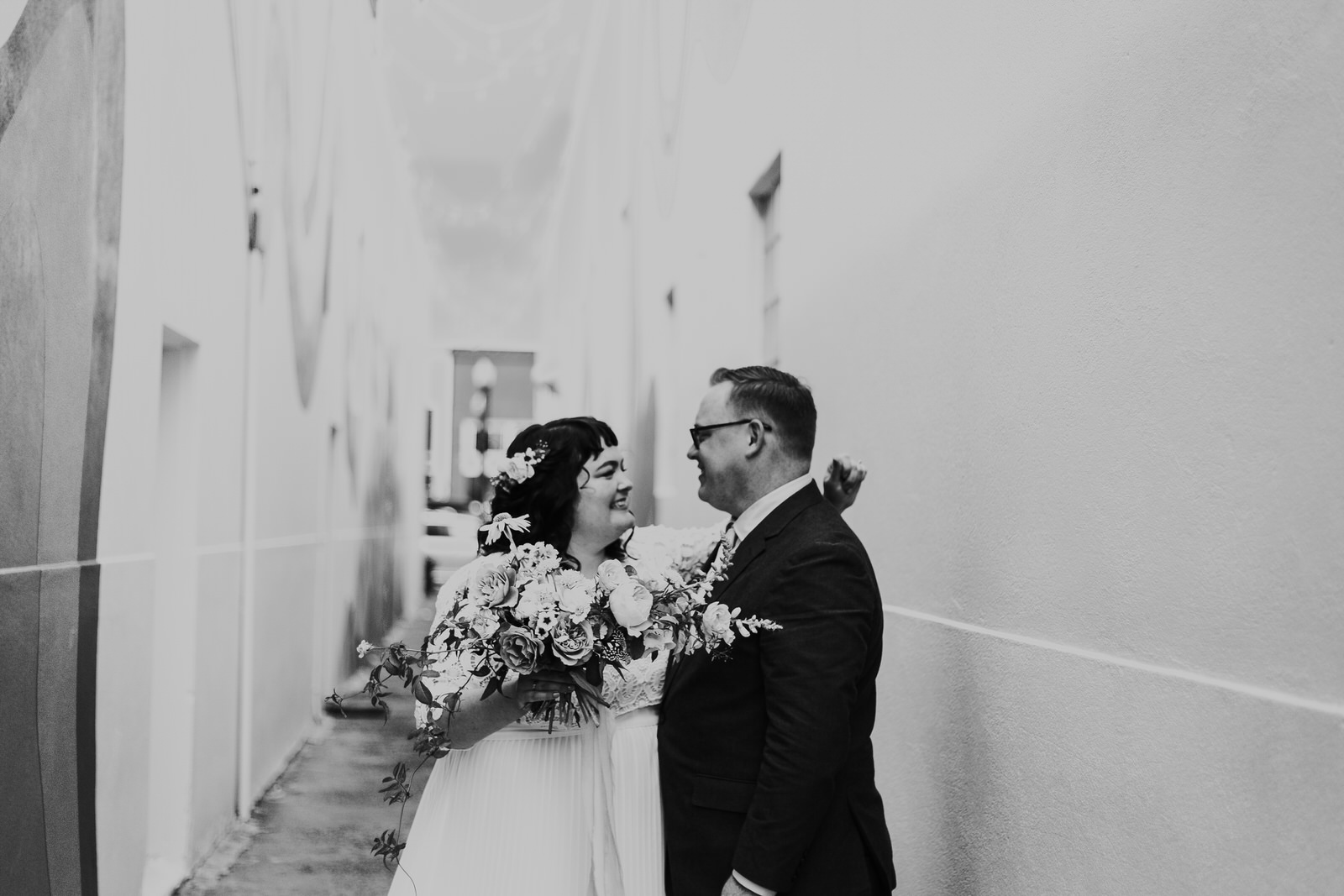 ashley joel astoria oregon the ruins wedding venue florals portland washington coast balloons vintage ceremony reception jamie carle feminist lgbtq lgbt couple photographer photography