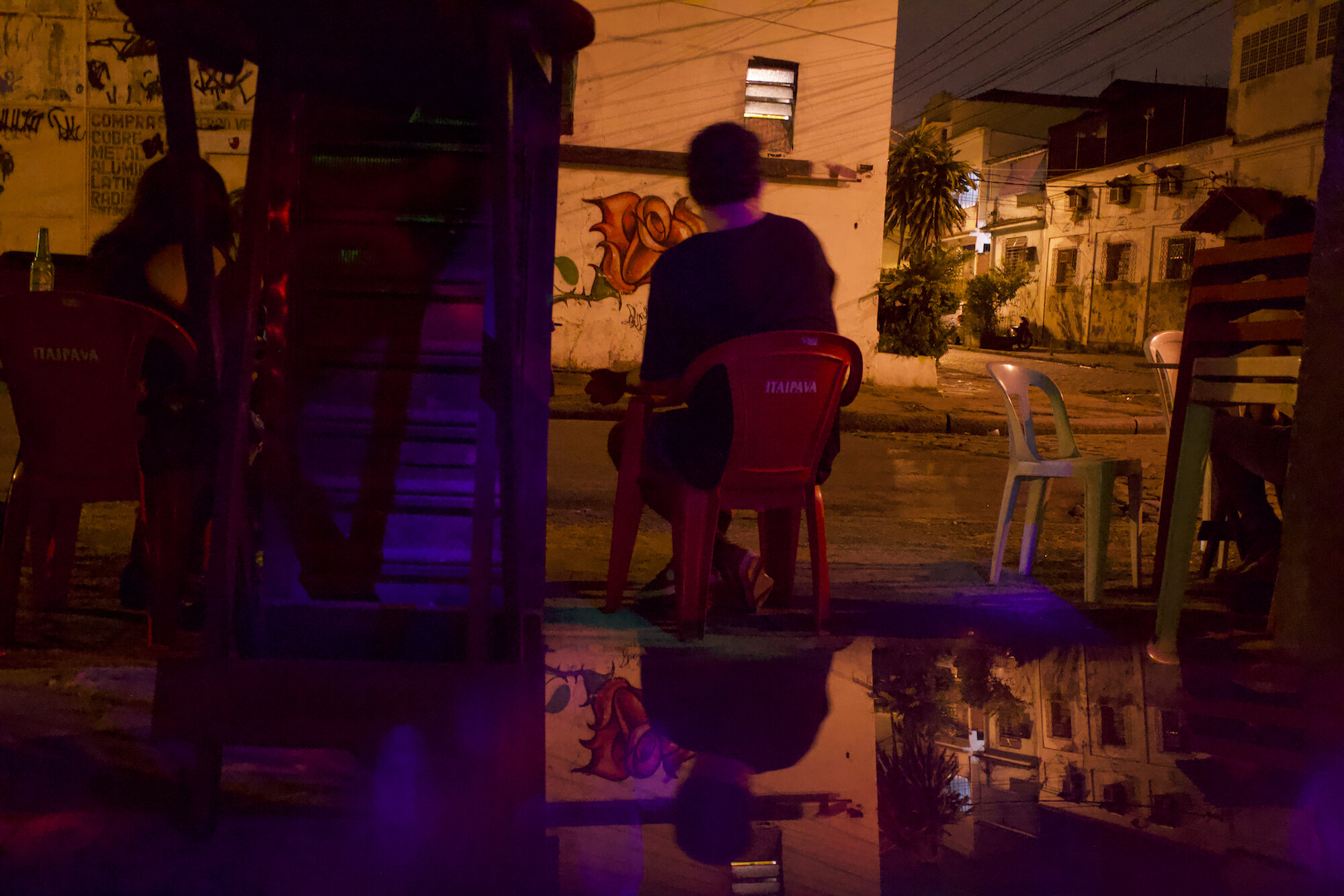 Man watches a street in Via Mimosa