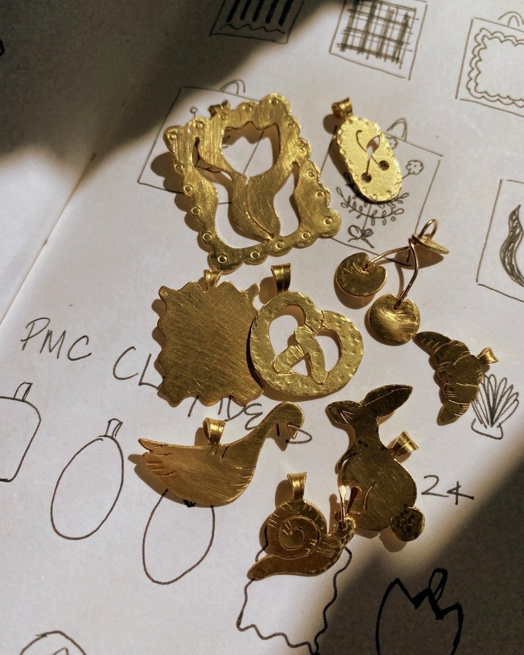 ✨The charm collection is coming along. I keep getting more and more ideas, it&rsquo;s kind of hard to stop! I&rsquo;m working with a laser cutter to help me cut the blanks so I can do all the stamping and details by hand. It&rsquo;s a real bummer I c