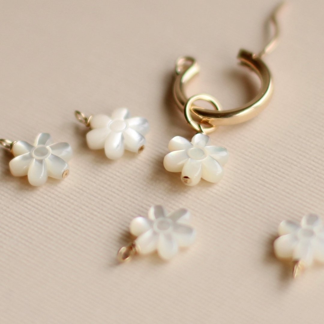 🌷 New earring bead charms are available in the shop in limited quantities! Perfect for spring, these little mother of pearl flowers are the sweetest. 

 #calexandria #cirealexandria #handmade #jewelry #artisianjewelry #jewelrybox #lovegold #trendset