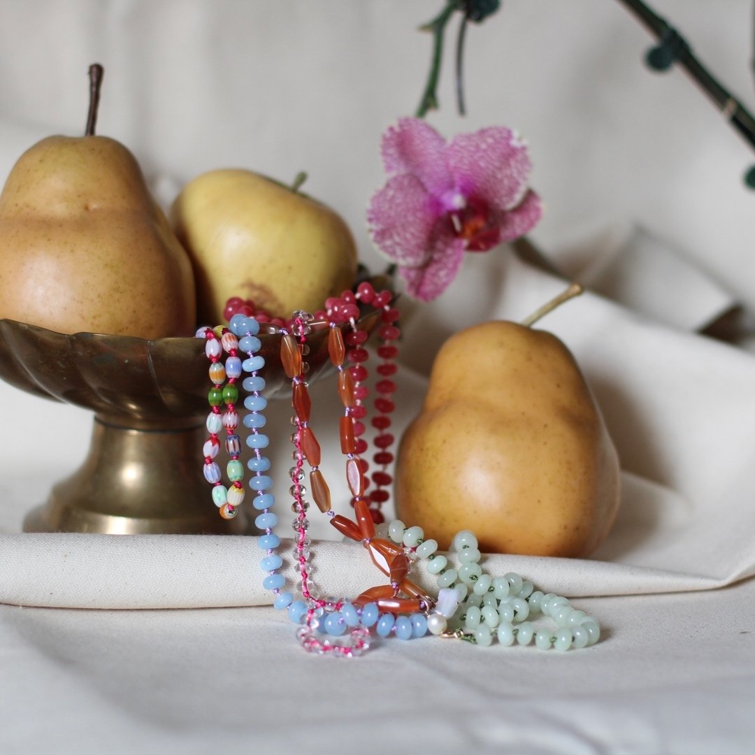 Beaded Necklaces are now available in the shop! These are all ONE of a Kind, hand knotted with nylon cord, stone and glass beads, fresh water pearls, glass beads and brass charms. These are fun, colorful and making them was a colorful dream! 
These l