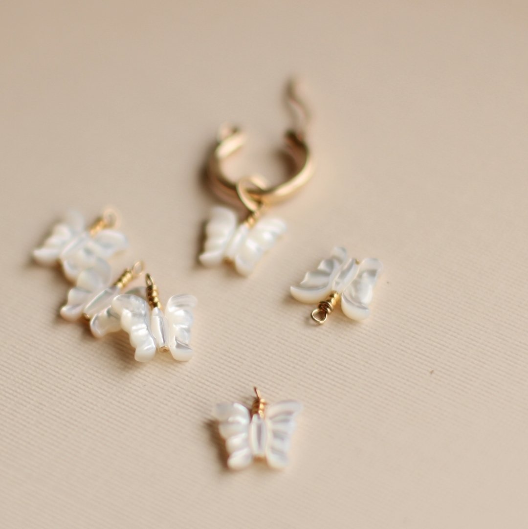 I guess I like most things with wings, moths, butterflies, birds.. these adorable Carved Mother of Pearl Butterflies are so sweet and fun to pair with the gemstone drops to create your own stack of hoop charms! 

 #calexandria #cirealexandria #jewelr