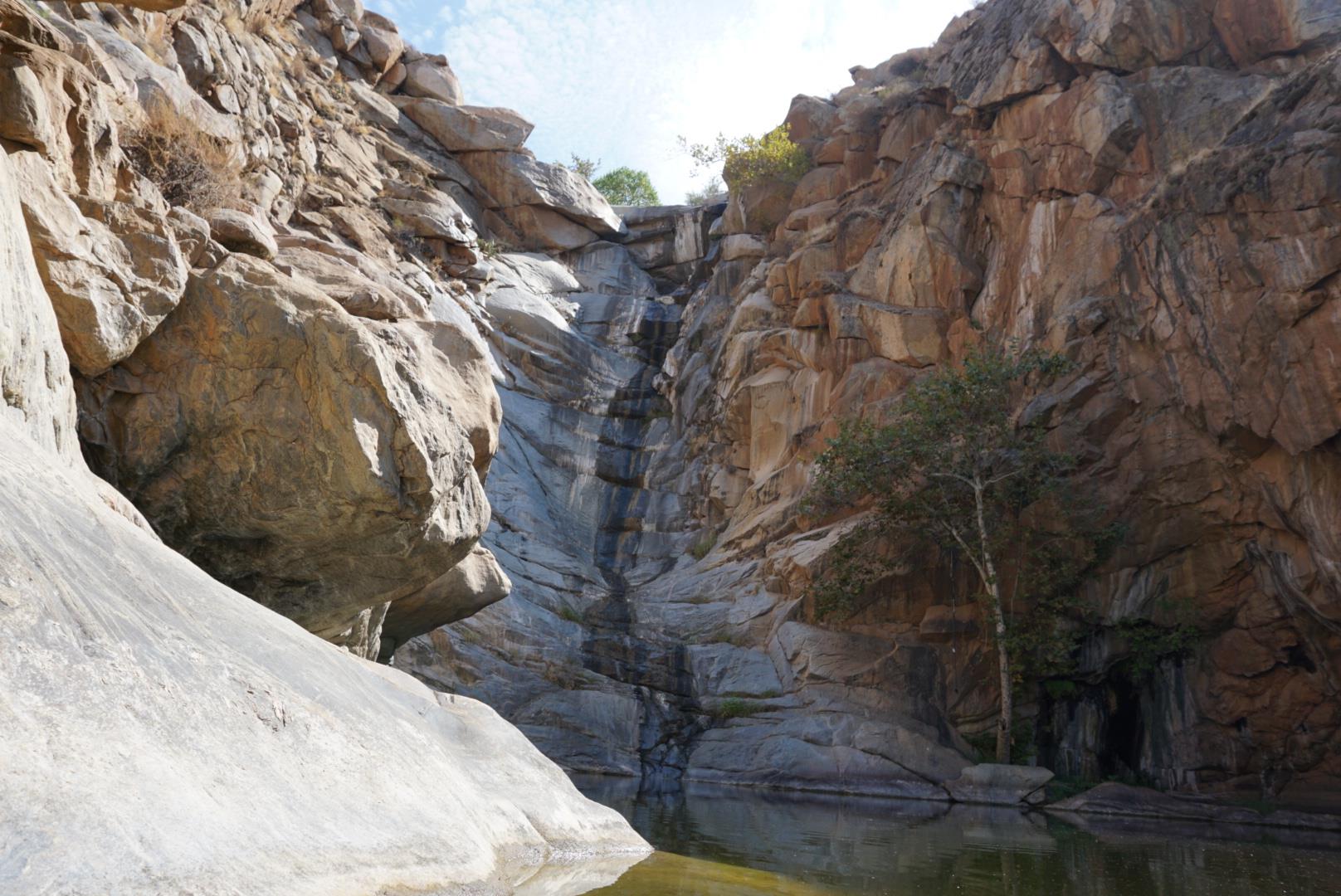 Water barely trickling down the cliff during the summer heat