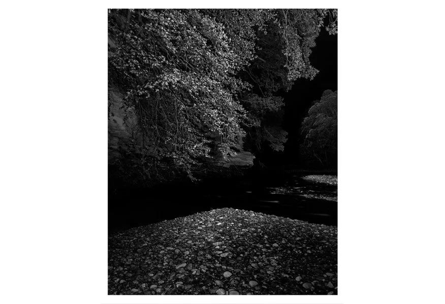 BY THE DARK RIVER