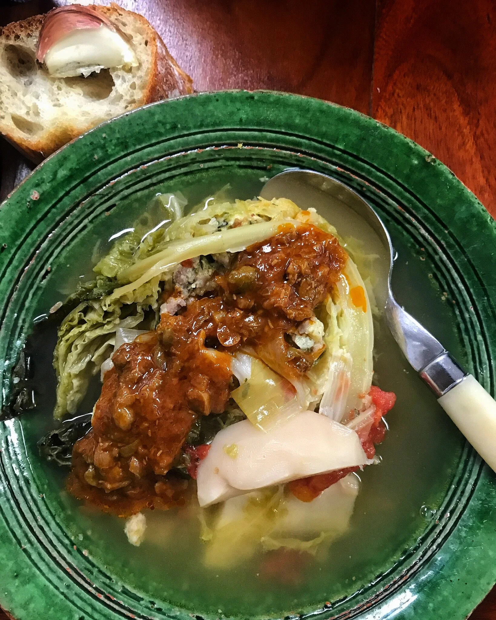 a slice of Poule Verte with it’s Tomato Caper Sauce.