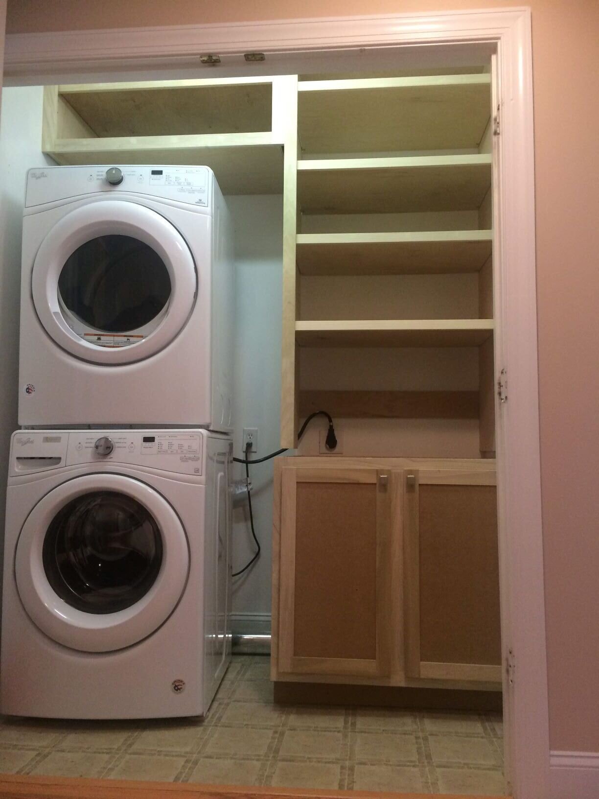  Poplar frame and birch plywood make a paint grade cabinet for this laundry closet. 