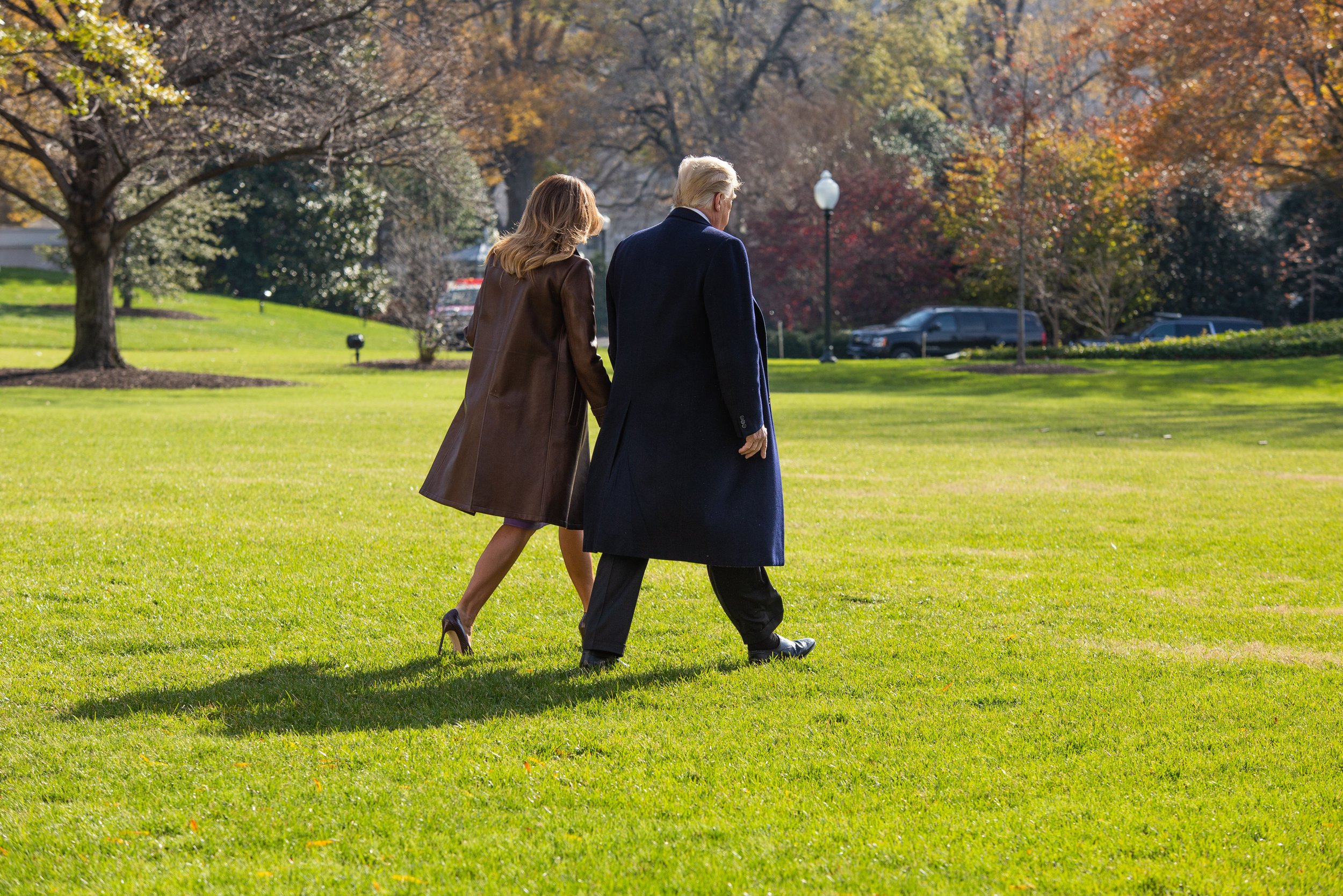  President Donald Trump and First Lady Melania Trump walk to Marine One after engaging with reporters outside the White House.    November 2019   