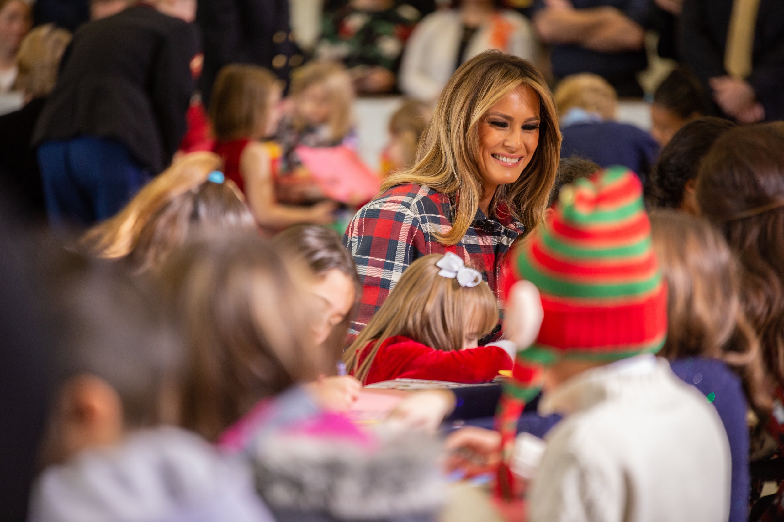  First Lady Melania Trump helps children write Christmas cards during the Marine Corps Toys for Tots event.    December 2018   