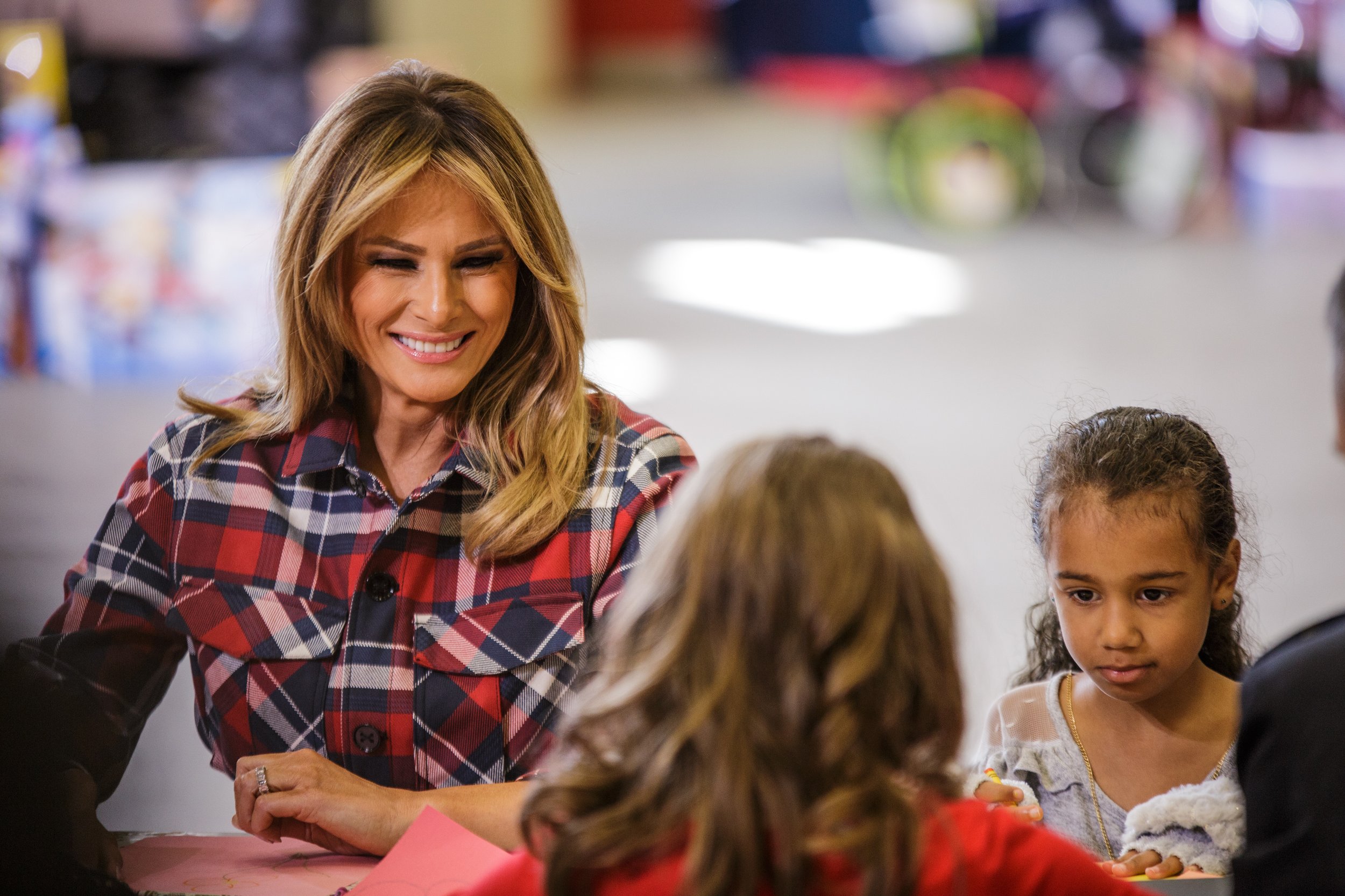  Melania Trump helps children write Christmas cards at the Marine Corps Toys for Tots event.    December 2018   