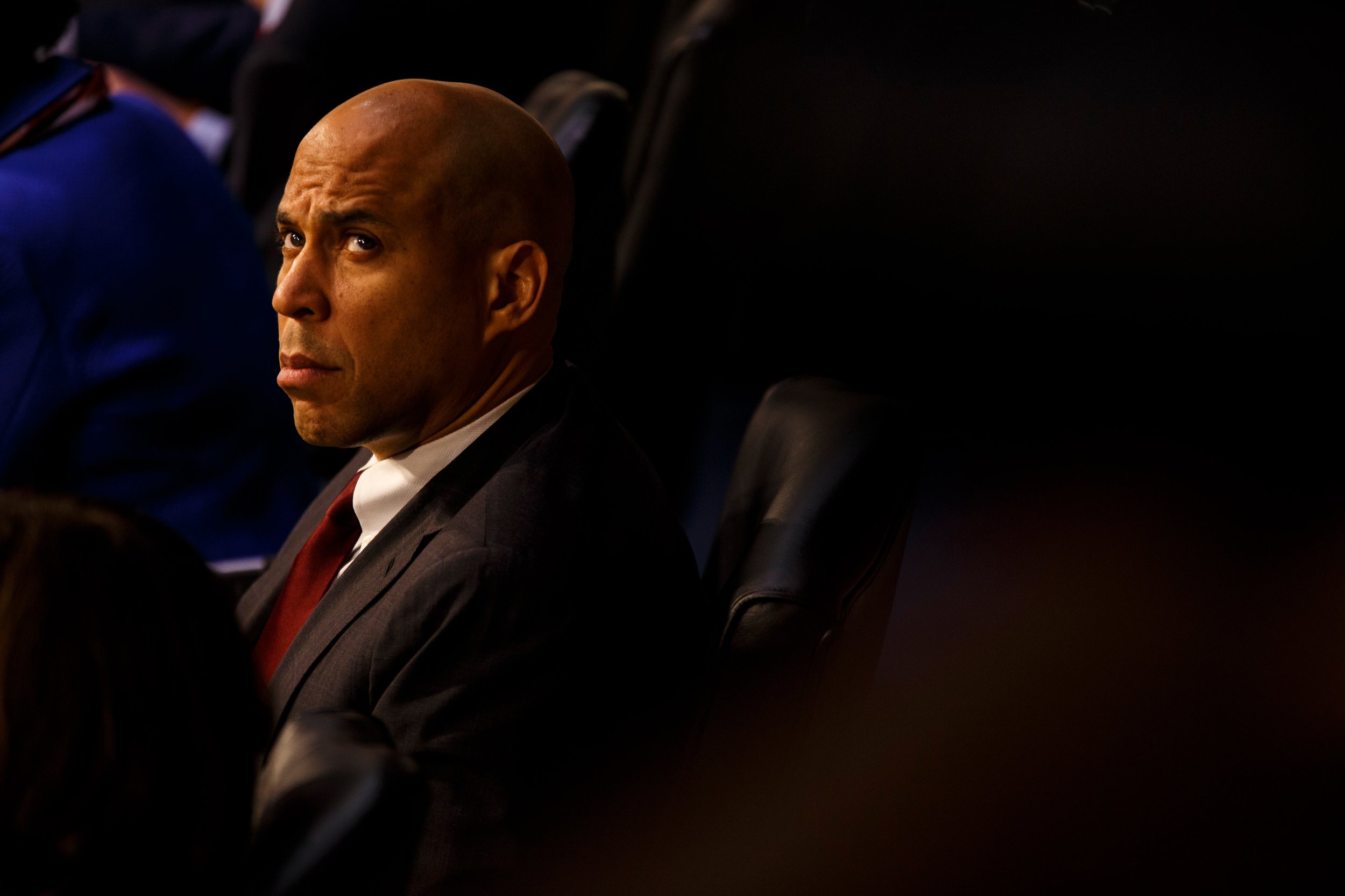  Senator Cory Booker (D - NJ) glances up at the press during the Senate Confirmation hearings for William Barr.    January 2019   