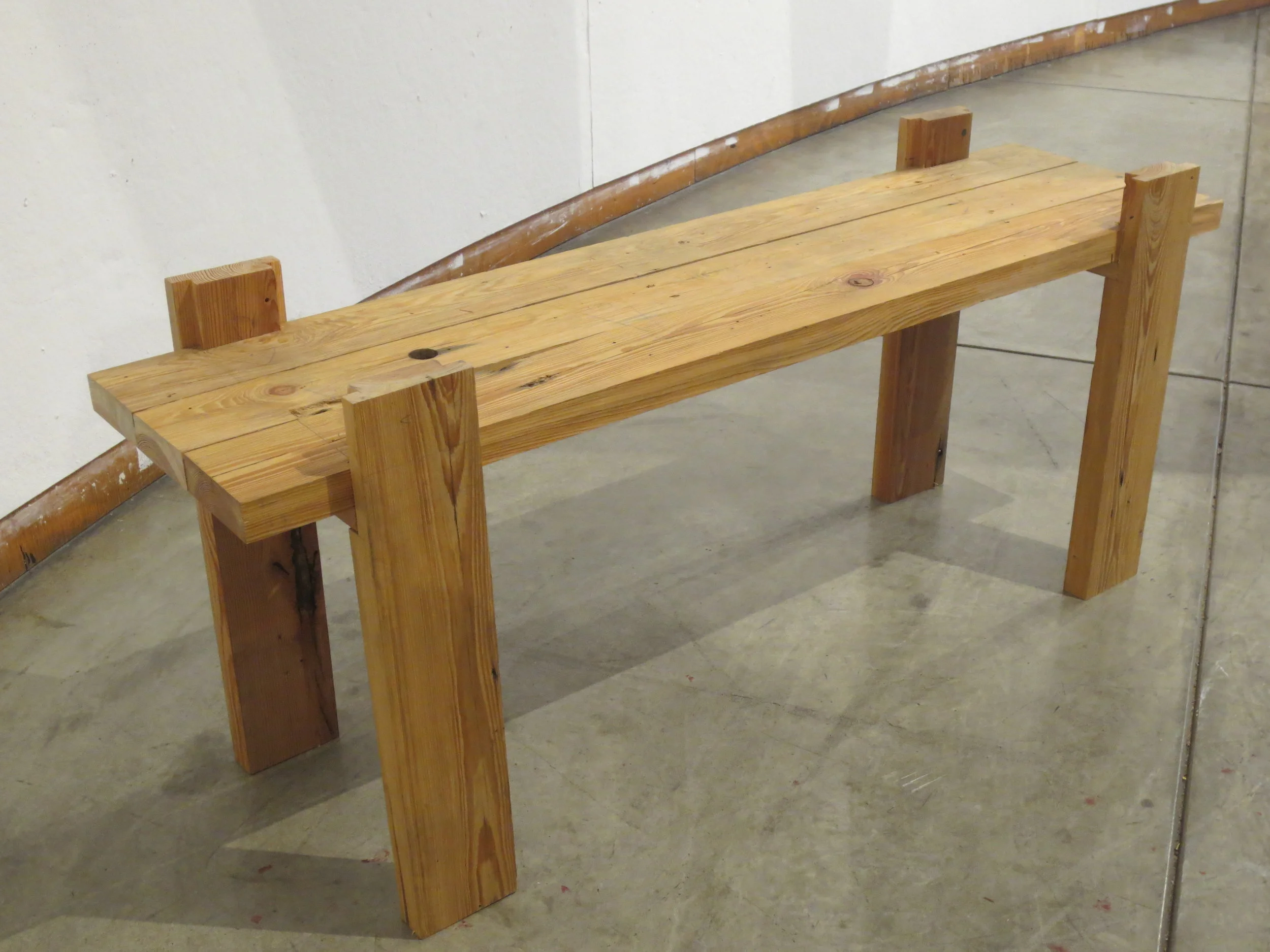 Dovetail-jointed bench, constructed by hand-saw without glue or hardware.