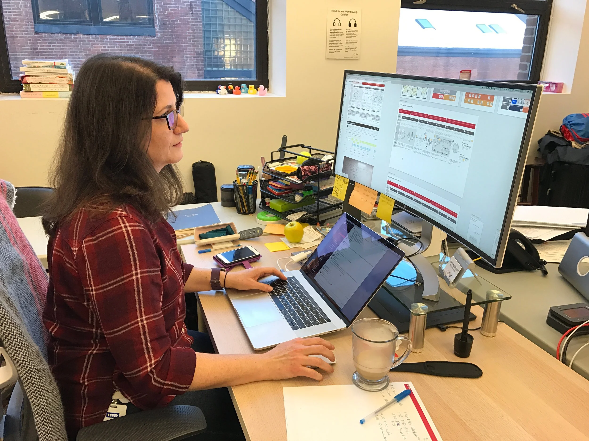 Lisa at her workstation at Confer Health.