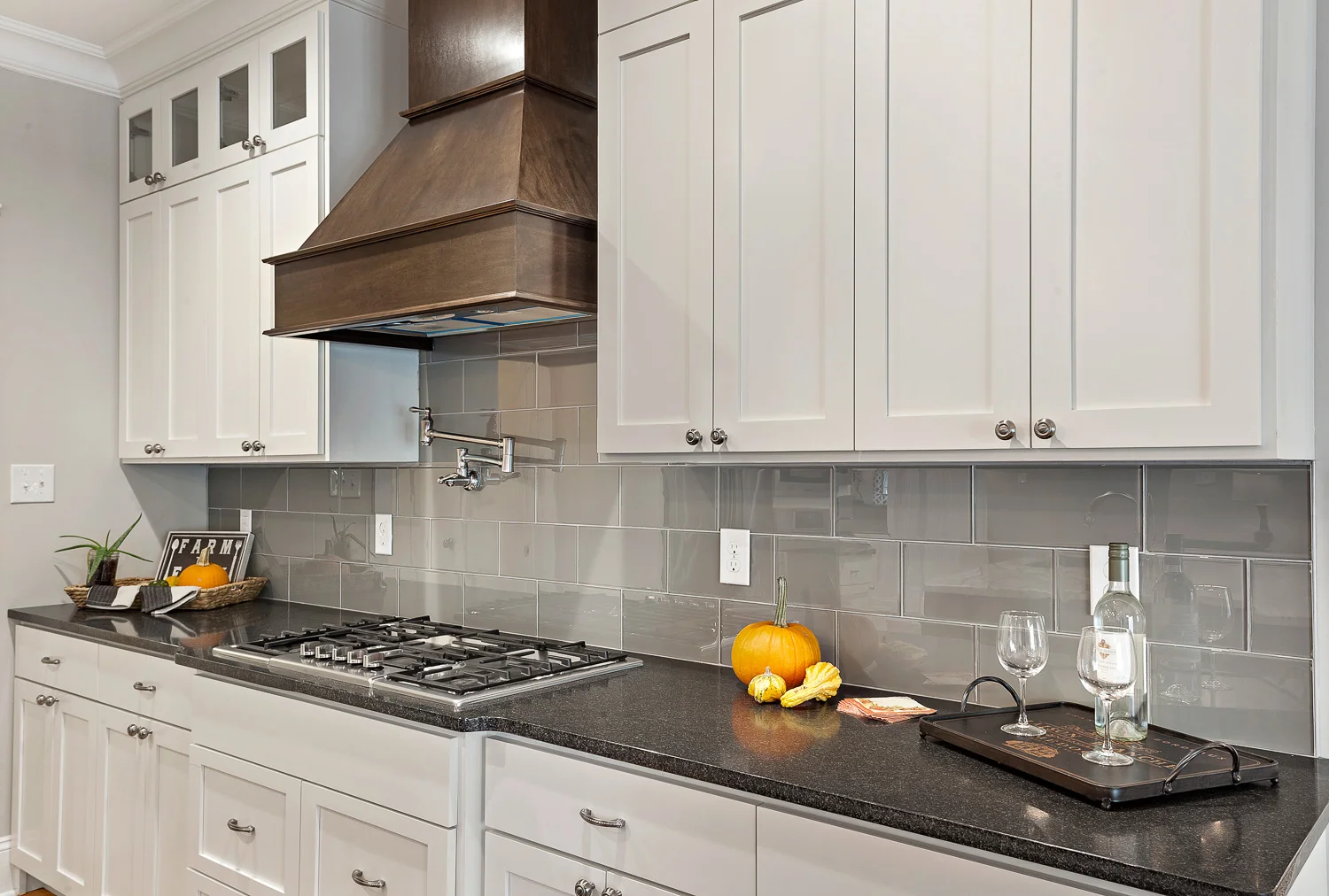 Custom White Kitchen with Granite Countertops and Grey Subway Tile