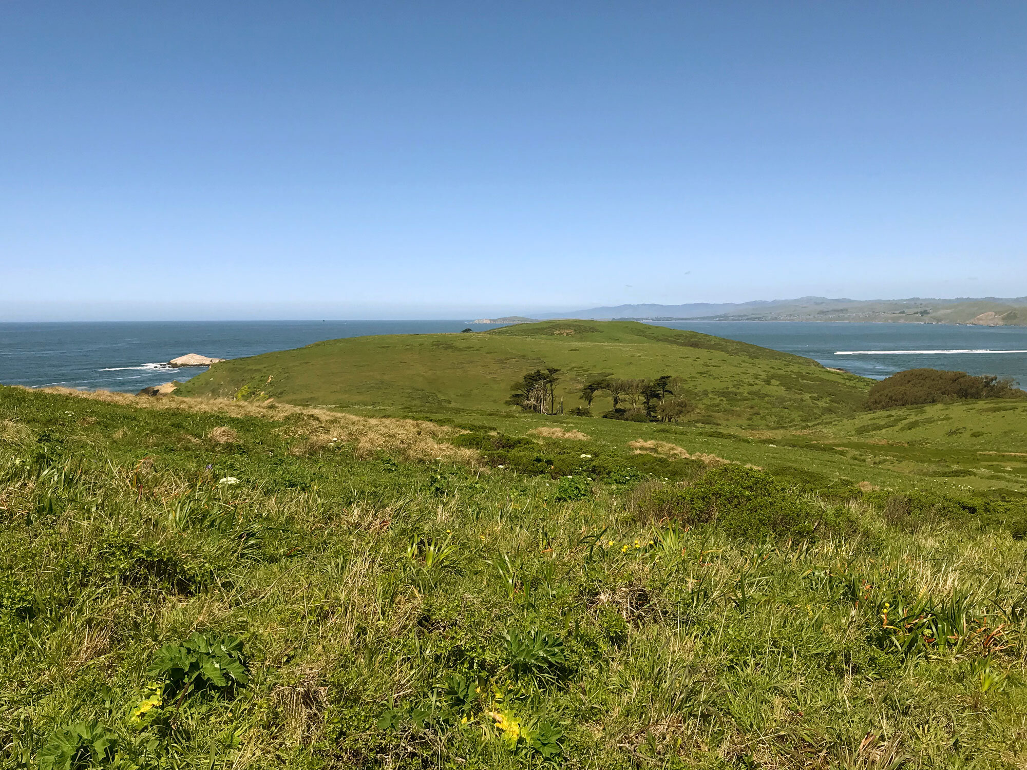 ocean meets bay at the end of the point